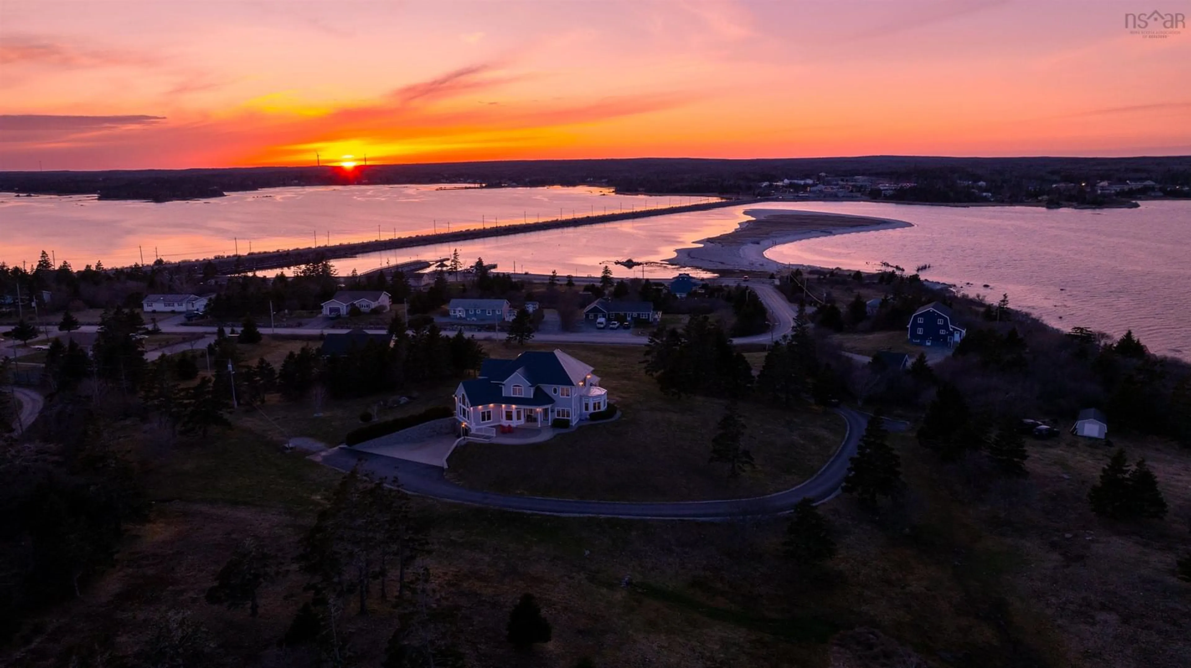A pic from outside/outdoor area/front of a property/back of a property/a pic from drone, water/lake/river/ocean view for 101 Mcgray Ave, North East Point Nova Scotia B0W 2P0