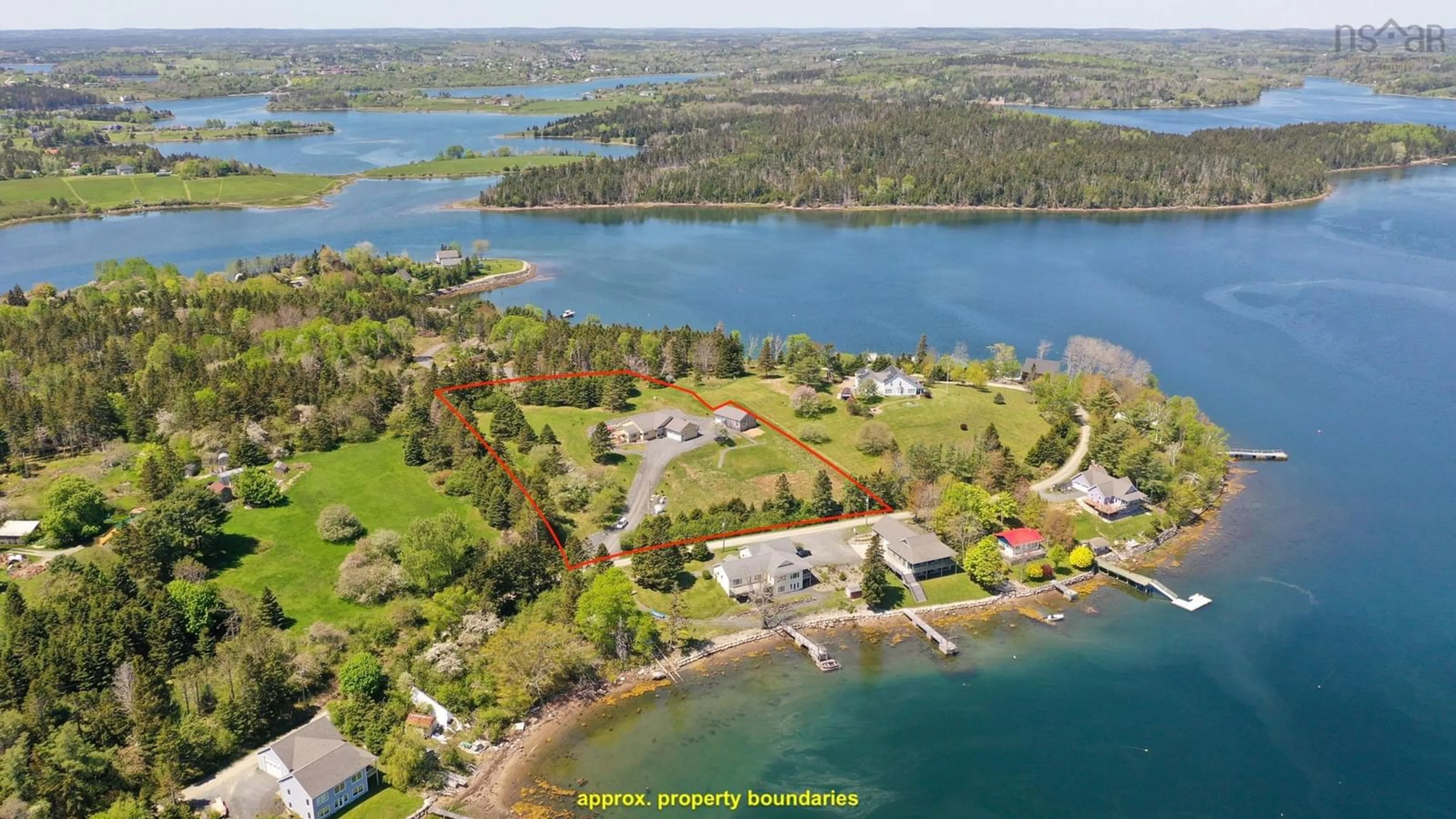 A pic from outside/outdoor area/front of a property/back of a property/a pic from drone, water/lake/river/ocean view for 207 Hebb Point Rd, Heckmans Island Nova Scotia B0J 2C0