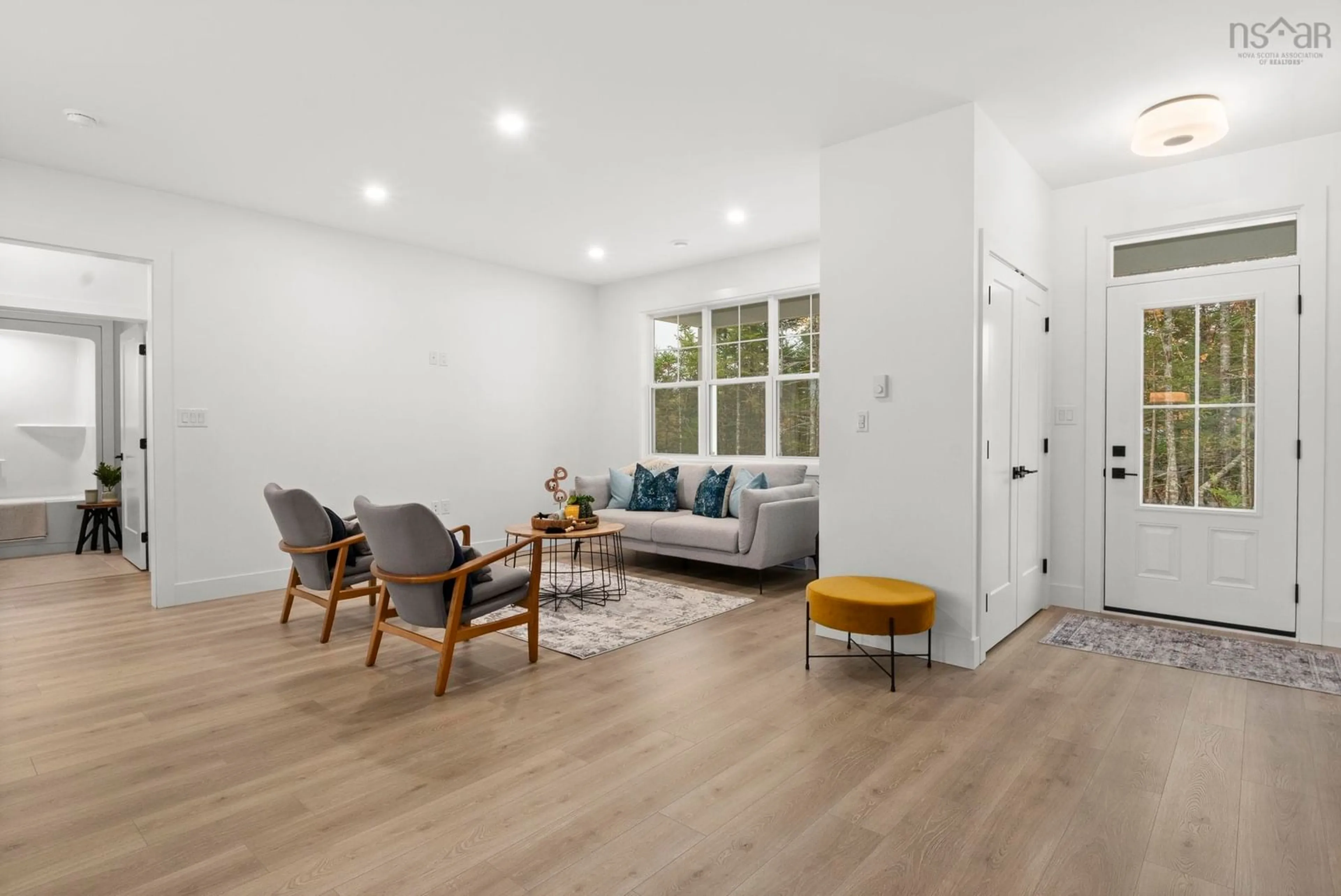 Living room with furniture, wood/laminate floor for 267 Sugarwood Crt, Porters Lake Nova Scotia B3E 0C7
