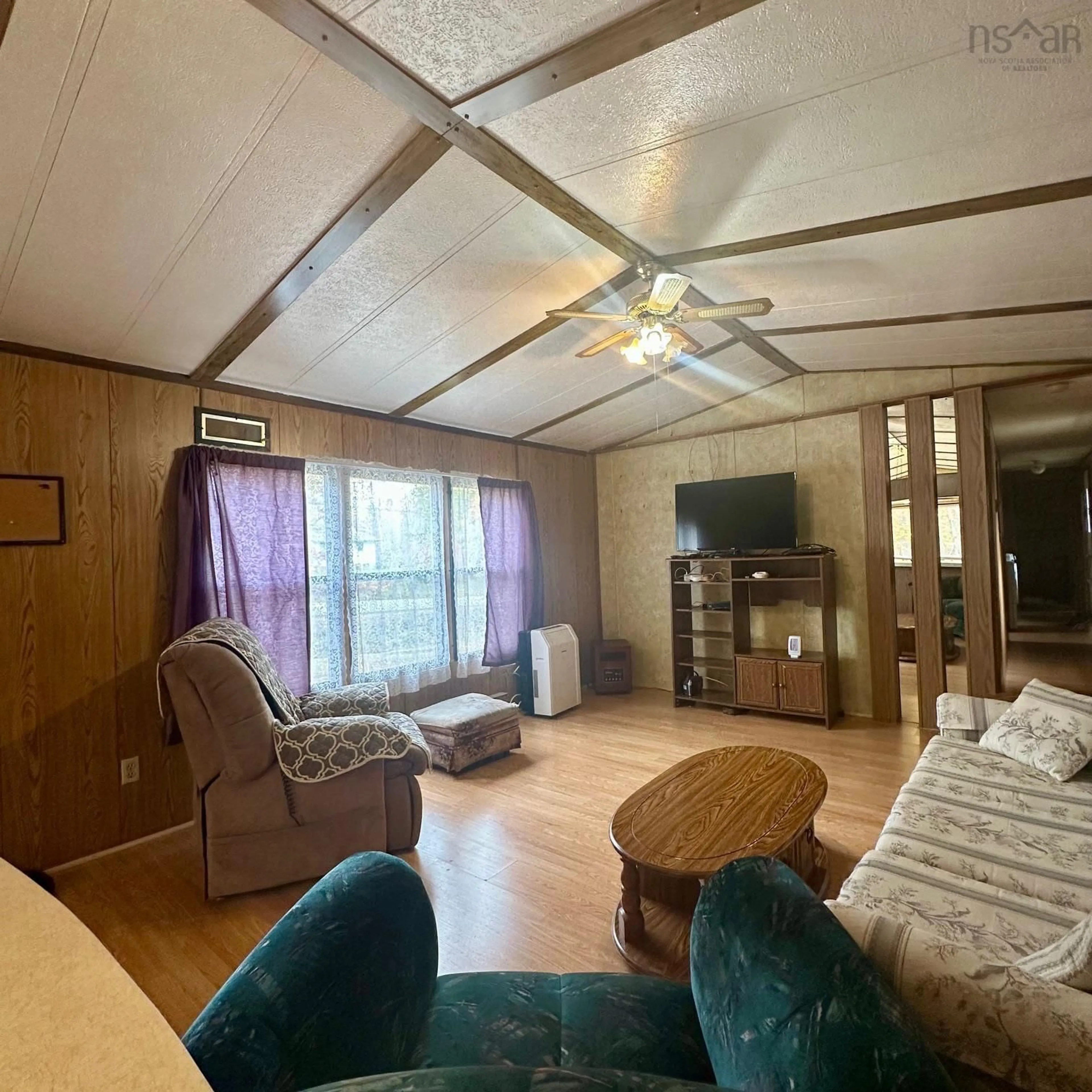 Living room with furniture, wood/laminate floor for 2977 Northfield Rd, Upper Northfield Nova Scotia B4V 4Y8
