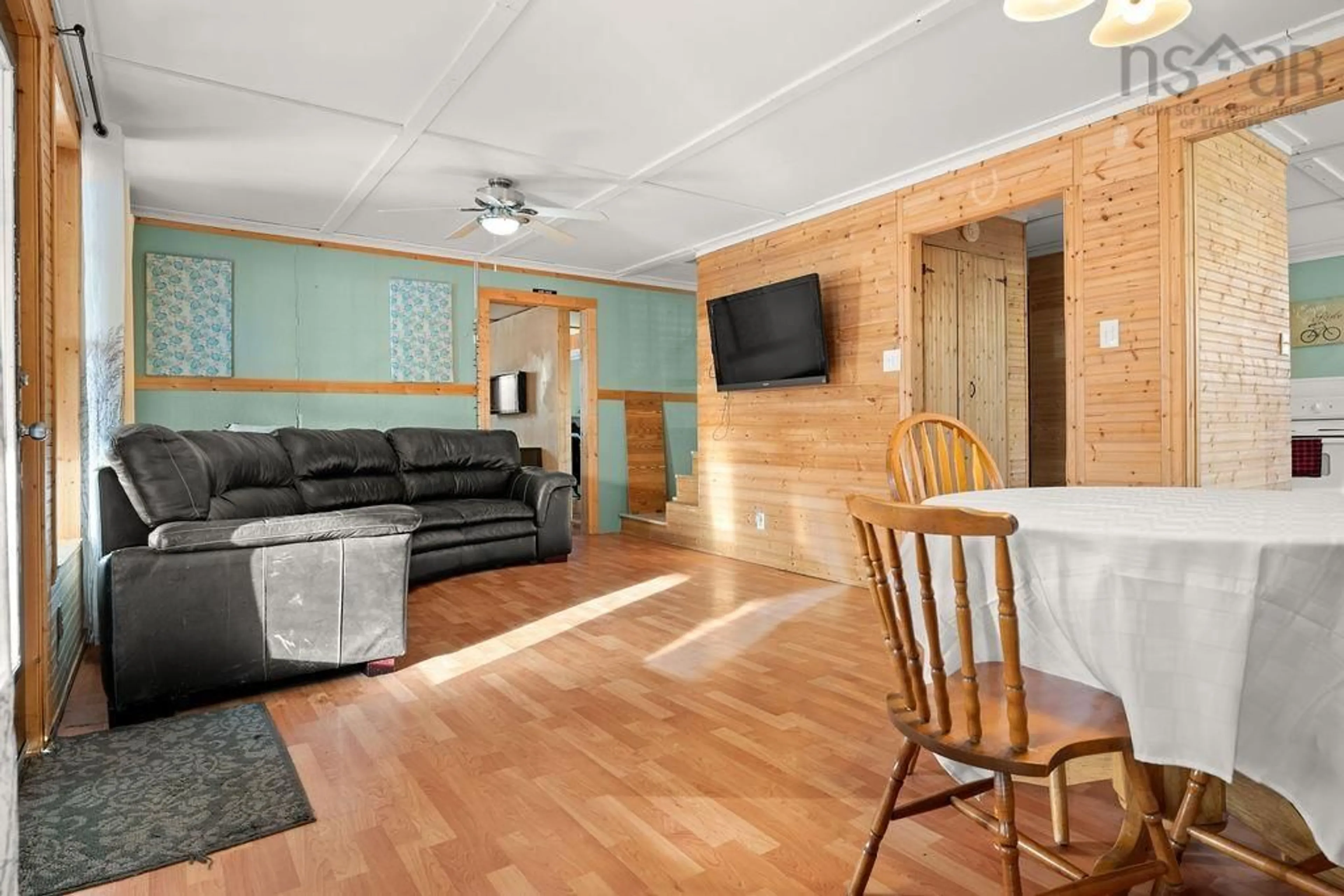 Living room with furniture, wood/laminate floor for 128 Aspen Dr, Port Howe Nova Scotia B0K 1K0