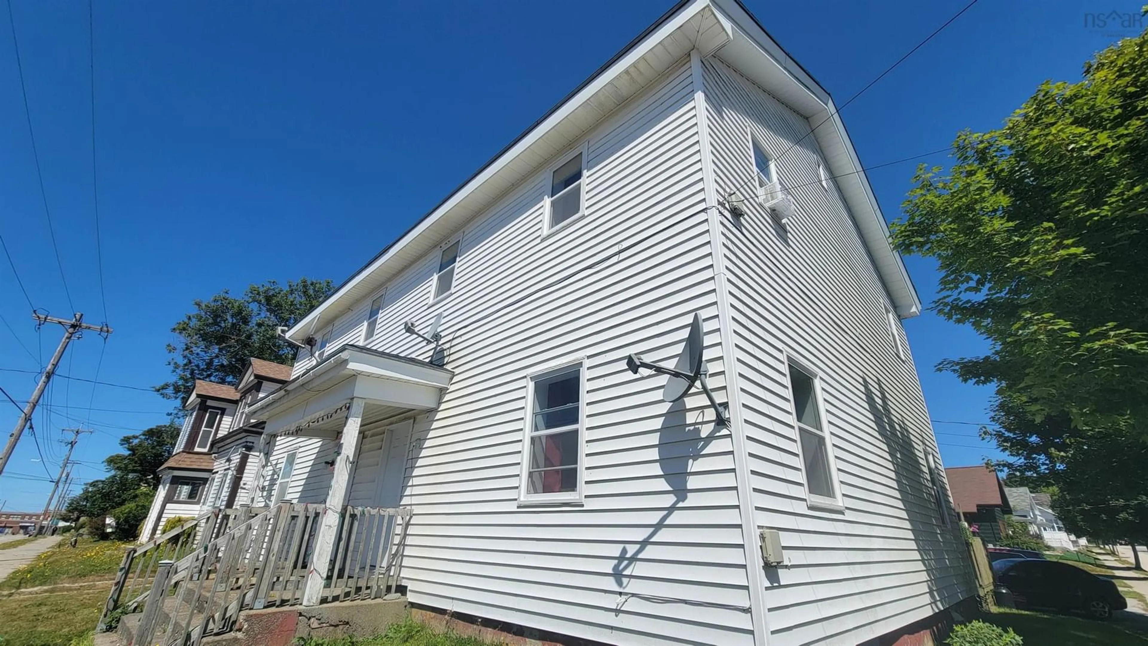 Home with vinyl exterior material, building for 24-26 Parade St, Yarmouth Nova Scotia B5A 3A7
