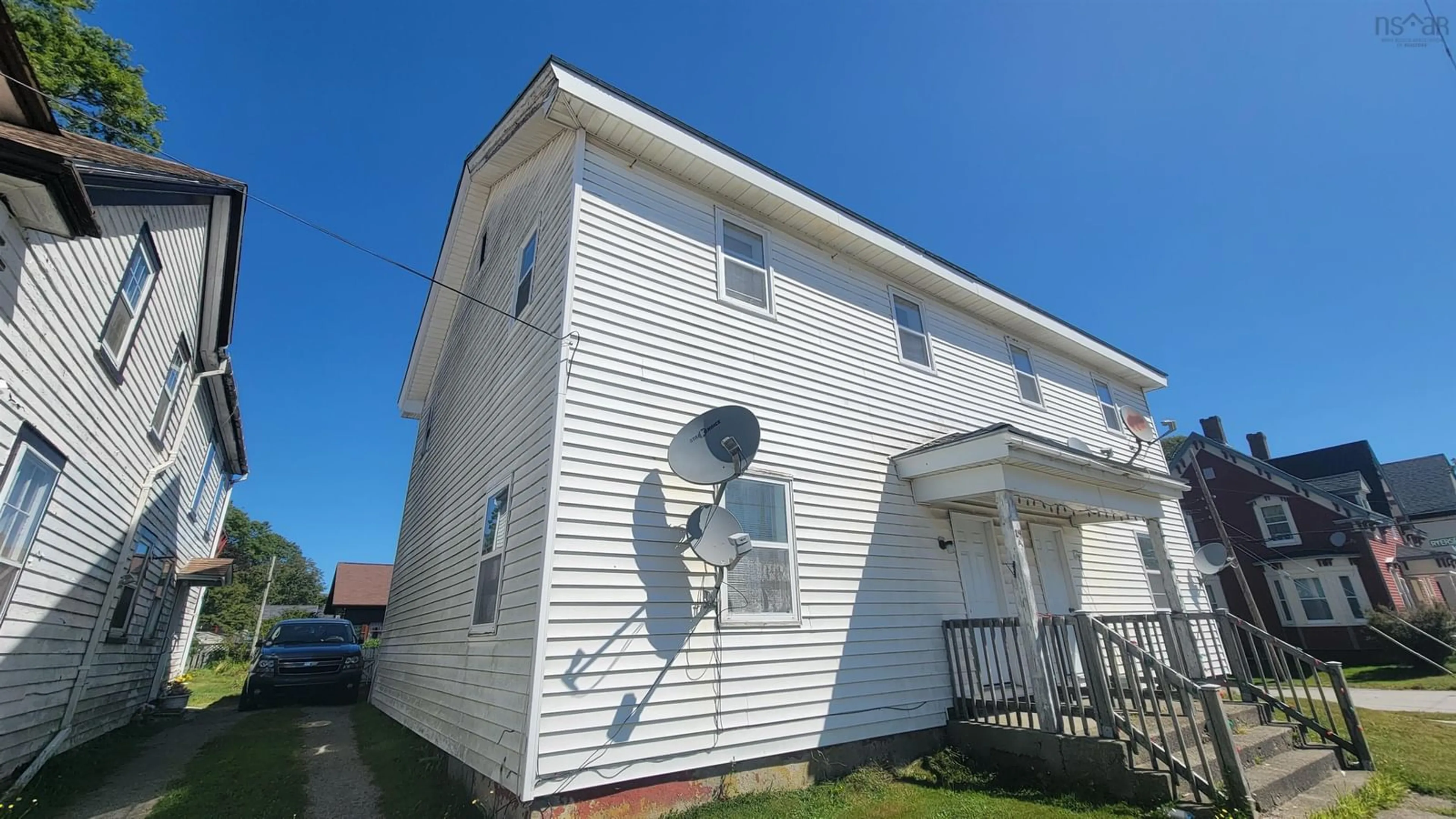 Home with vinyl exterior material, building for 24-26 Parade St, Yarmouth Nova Scotia B5A 3A7