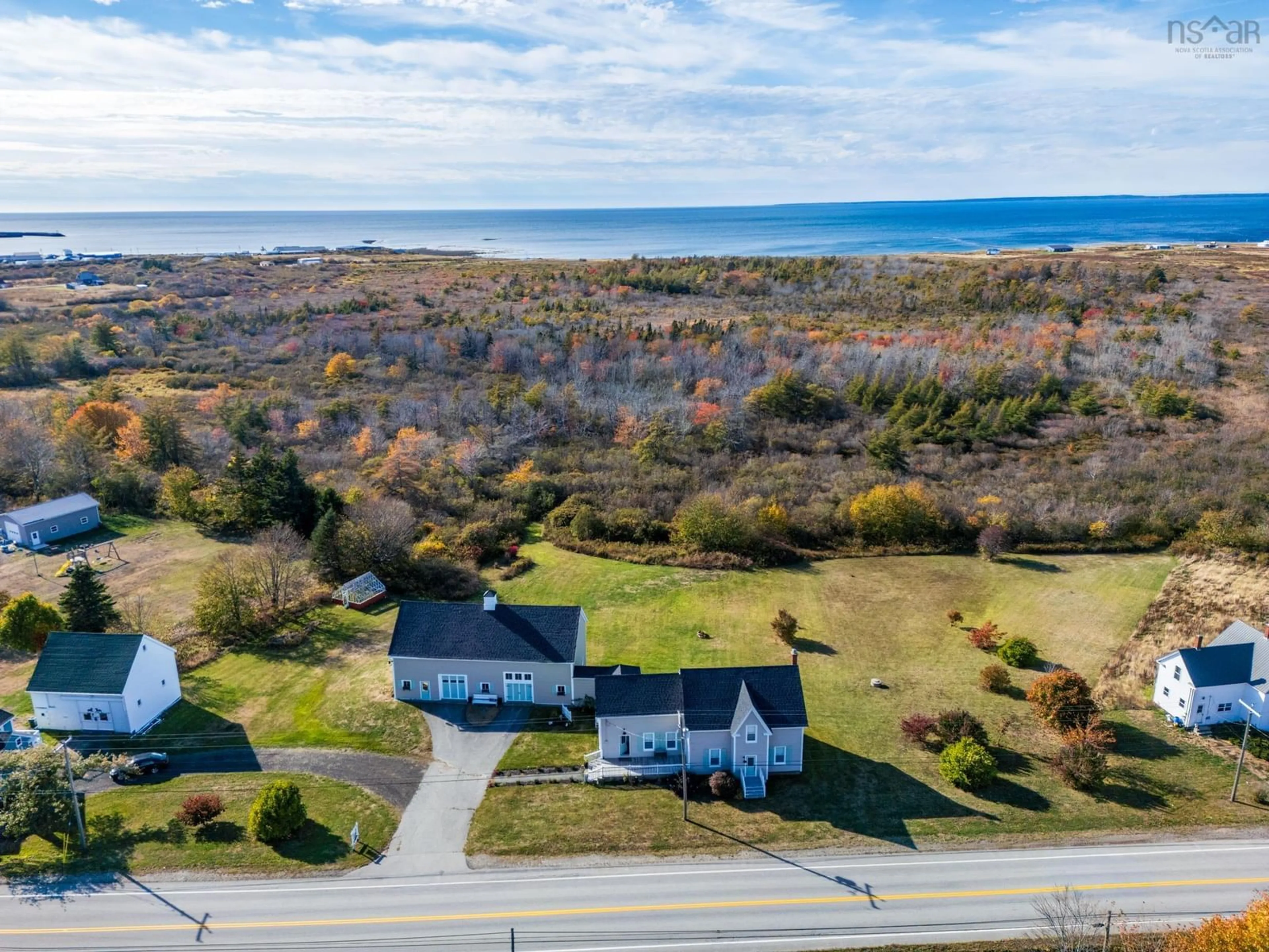 A pic from outside/outdoor area/front of a property/back of a property/a pic from drone, water/lake/river/ocean view for 8793 Highway 1, Meteghan River Nova Scotia B0W 2K0