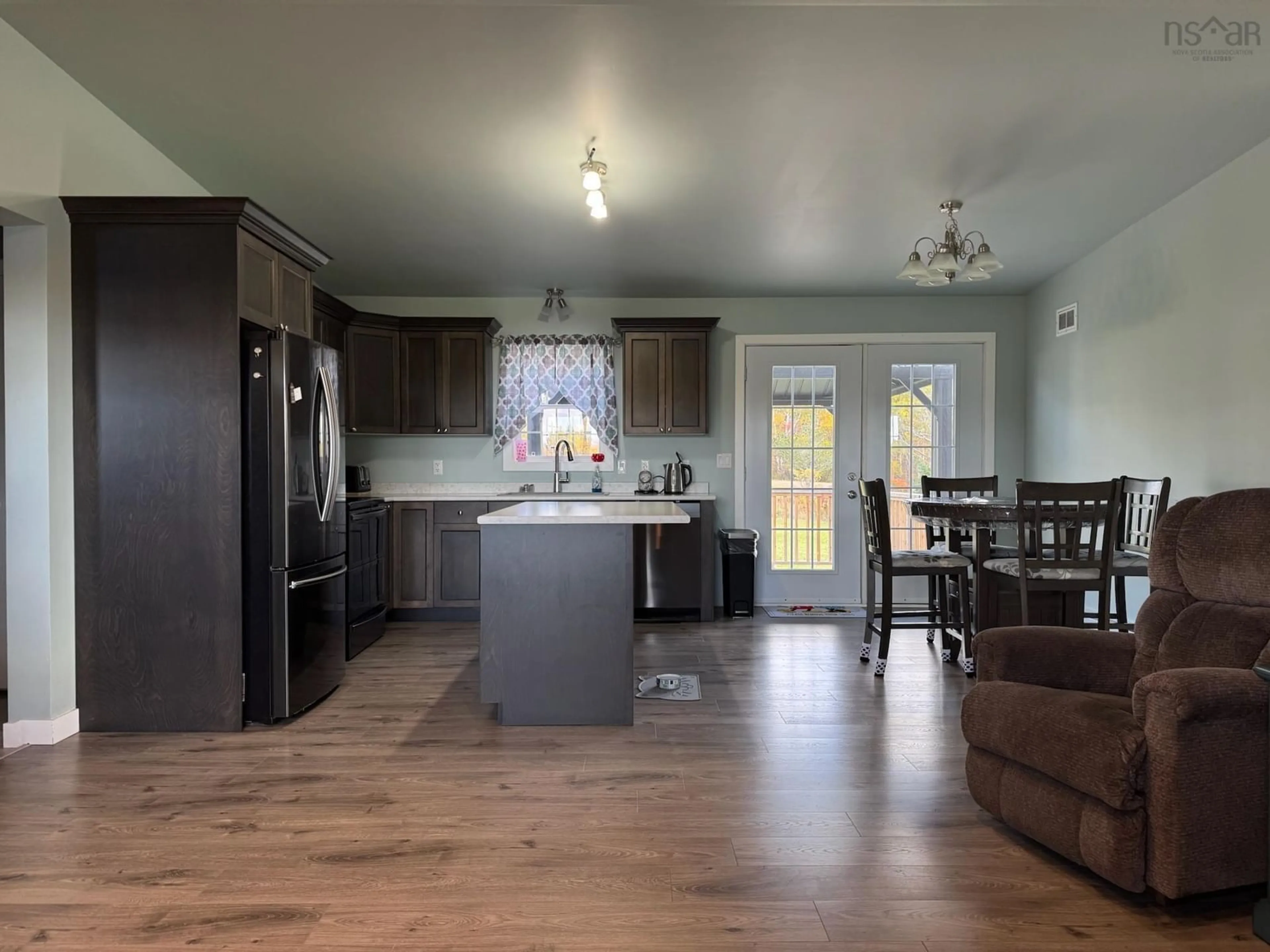 Open concept kitchen, wood/laminate floor for 11 Brynlees Lane, Mabou Nova Scotia B0E 1X0
