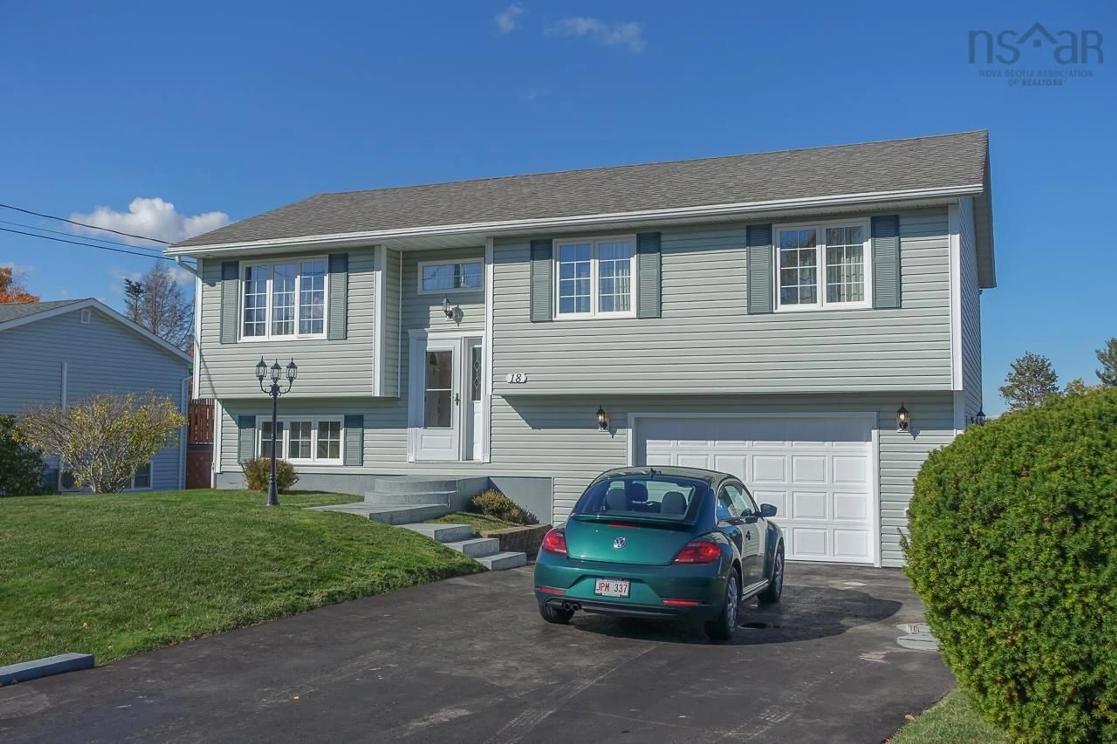 Home with vinyl exterior material, street for 18 Jordan St, New Minas Nova Scotia B4N 5G7
