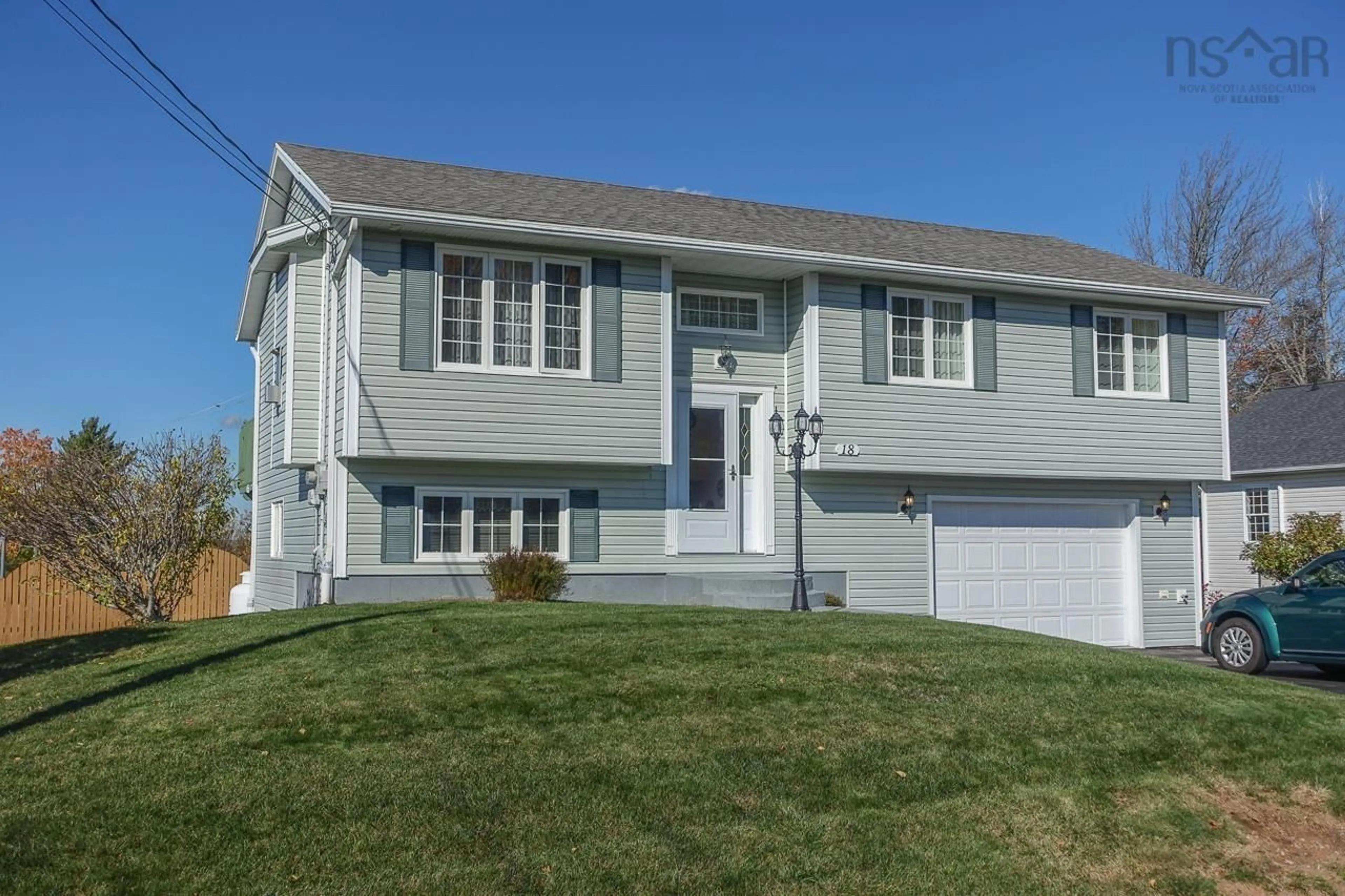 Home with vinyl exterior material, street for 18 Jordan St, New Minas Nova Scotia B4N 5G7