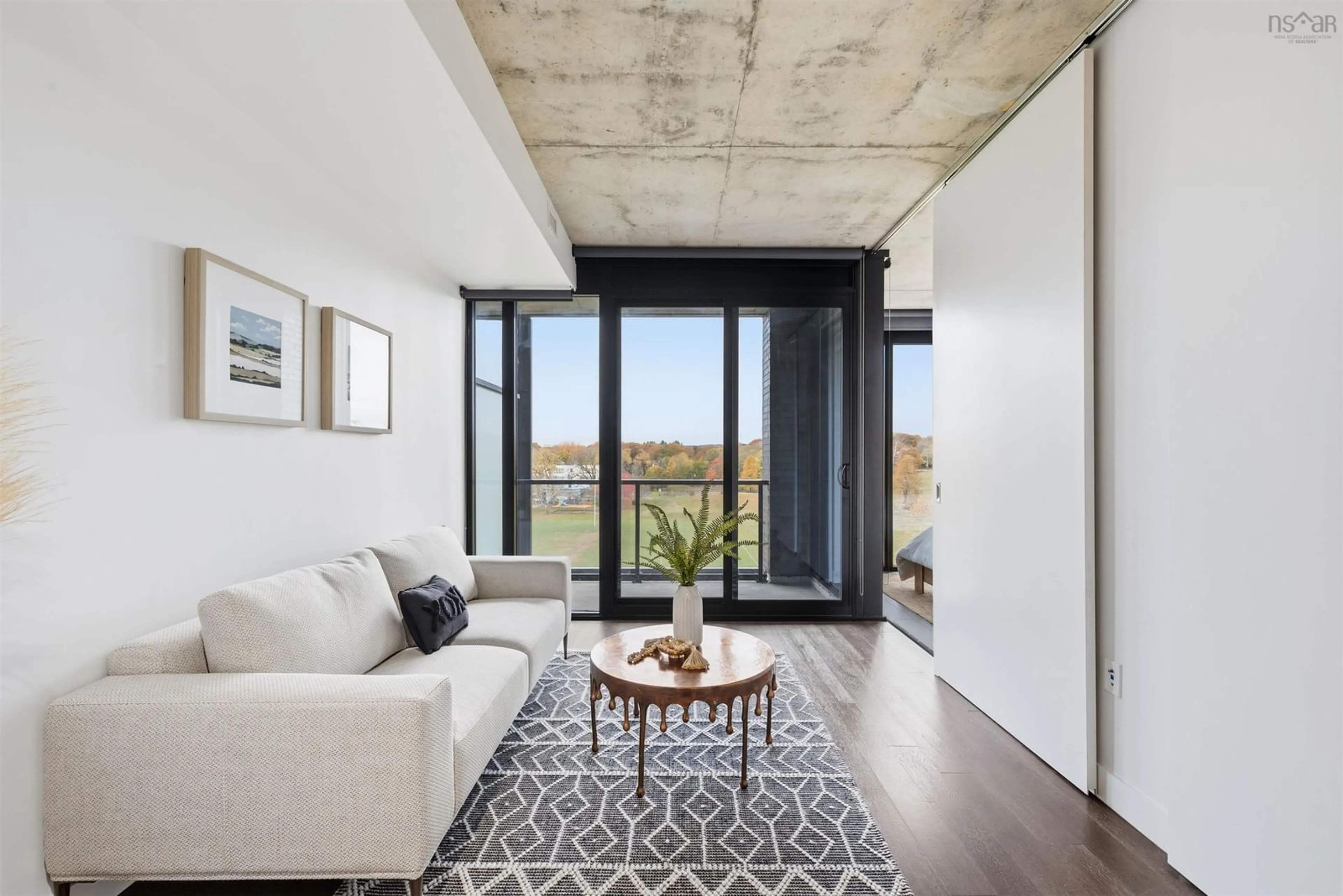 Living room with furniture, cement floor for 1048 Wellington St #602, Halifax Nova Scotia B3H 0C2