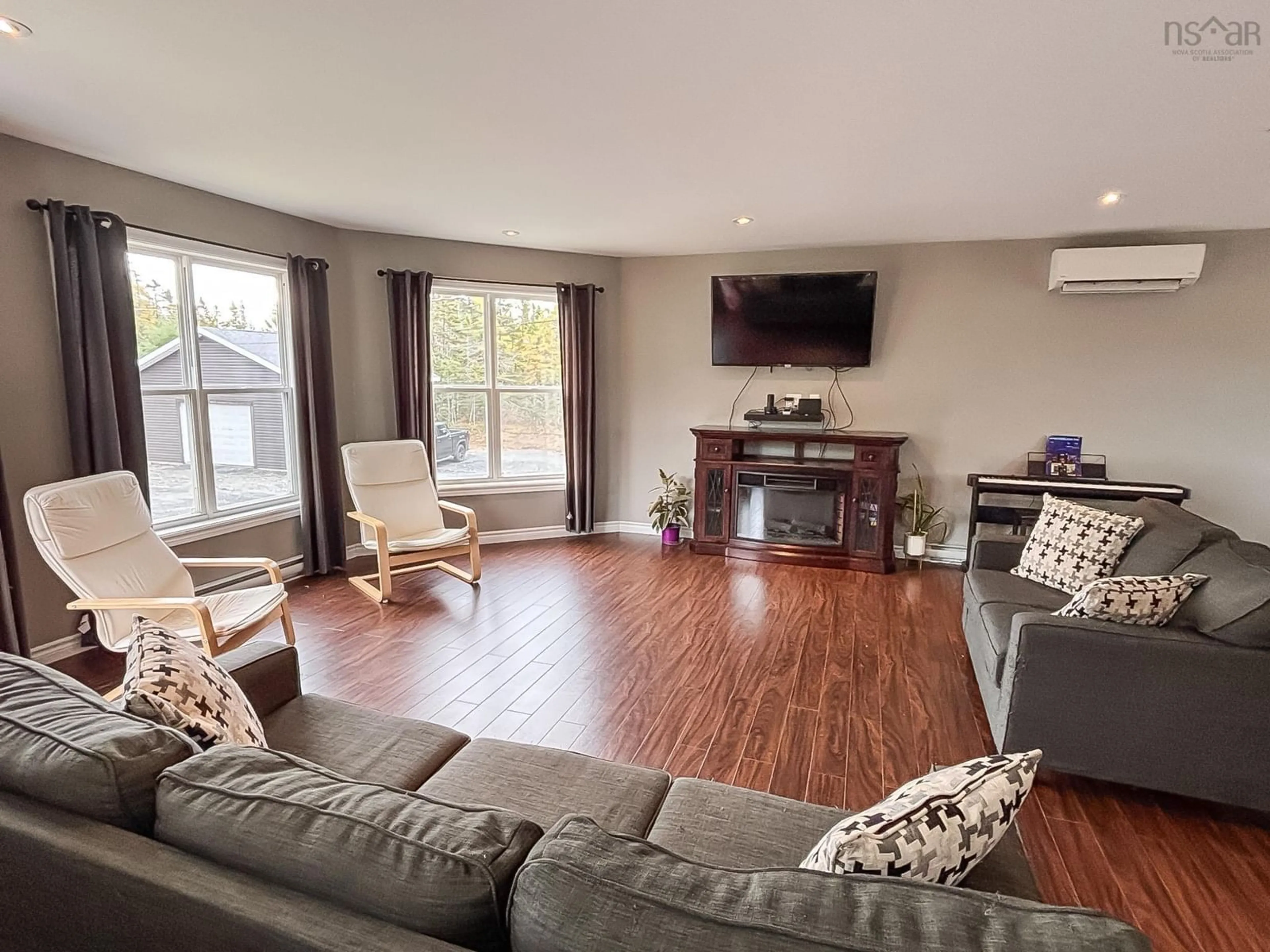 Living room with furniture, wood/laminate floor for 2120 Highway 332, Bayport Nova Scotia B0J 2C0