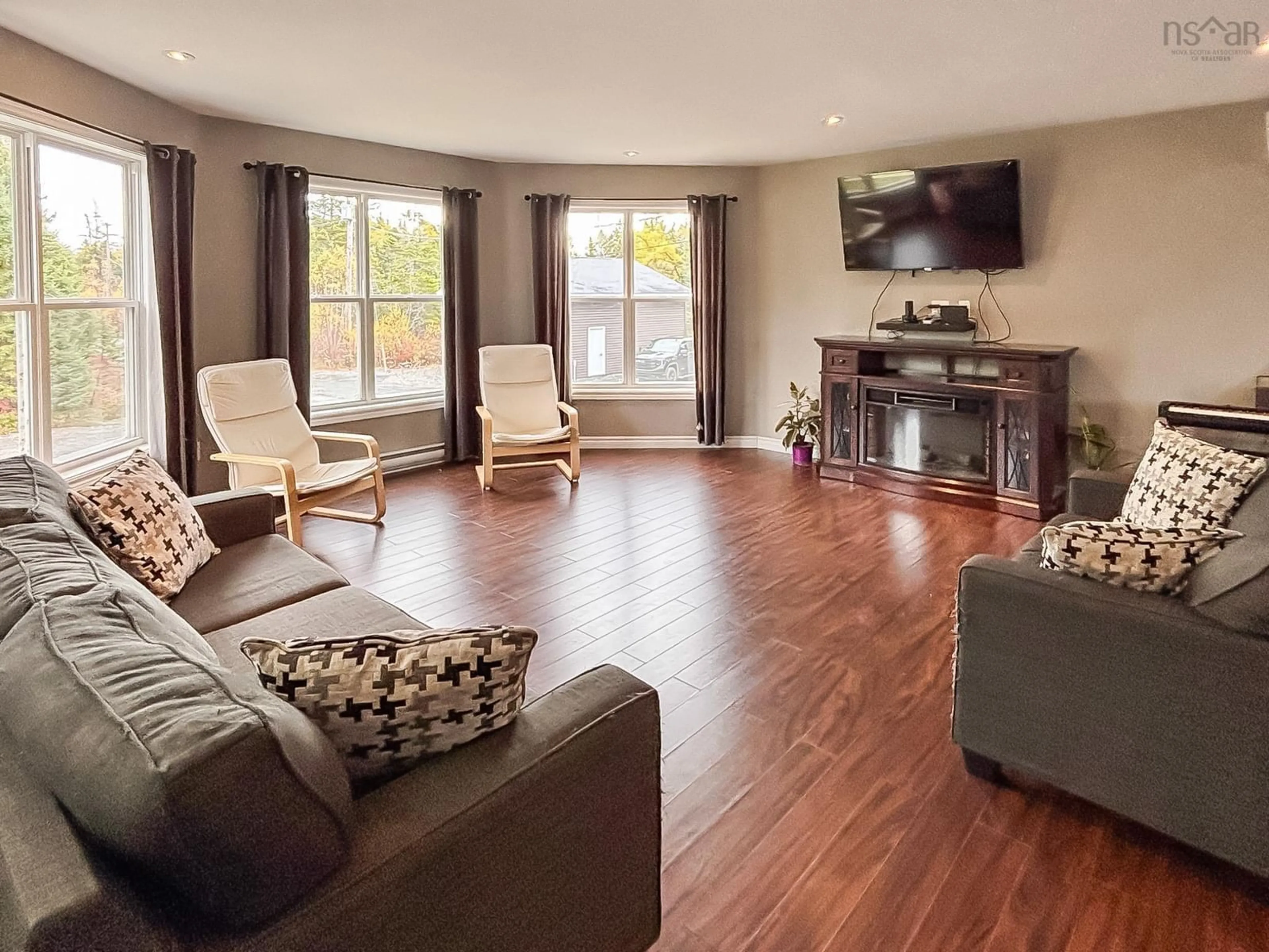 Living room with furniture, wood/laminate floor for 2120 Highway 332, Bayport Nova Scotia B0J 2C0