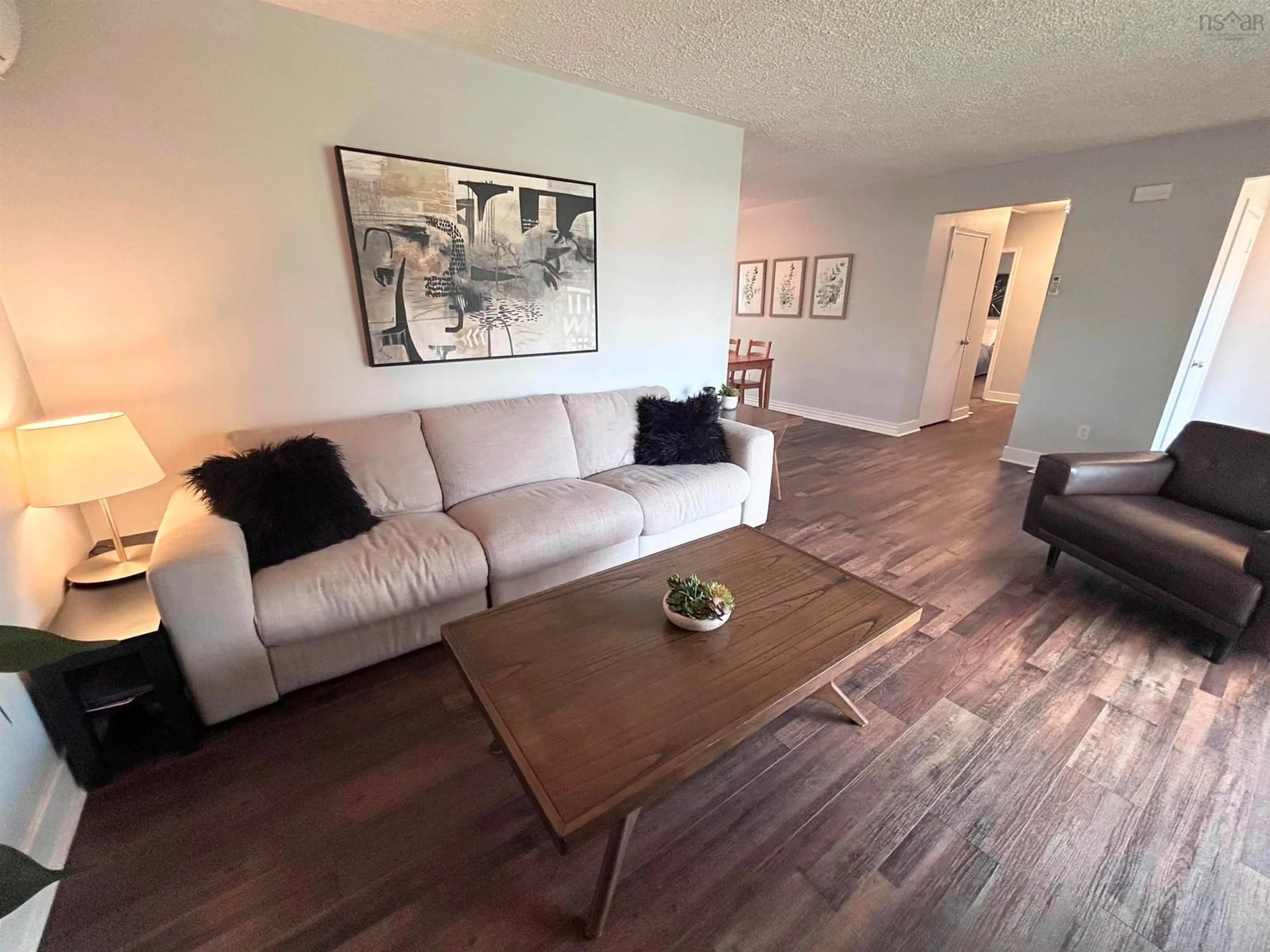 Living room with furniture, wood/laminate floor for 32 Lawson Ave, Dartmouth Nova Scotia B2W 2Z3