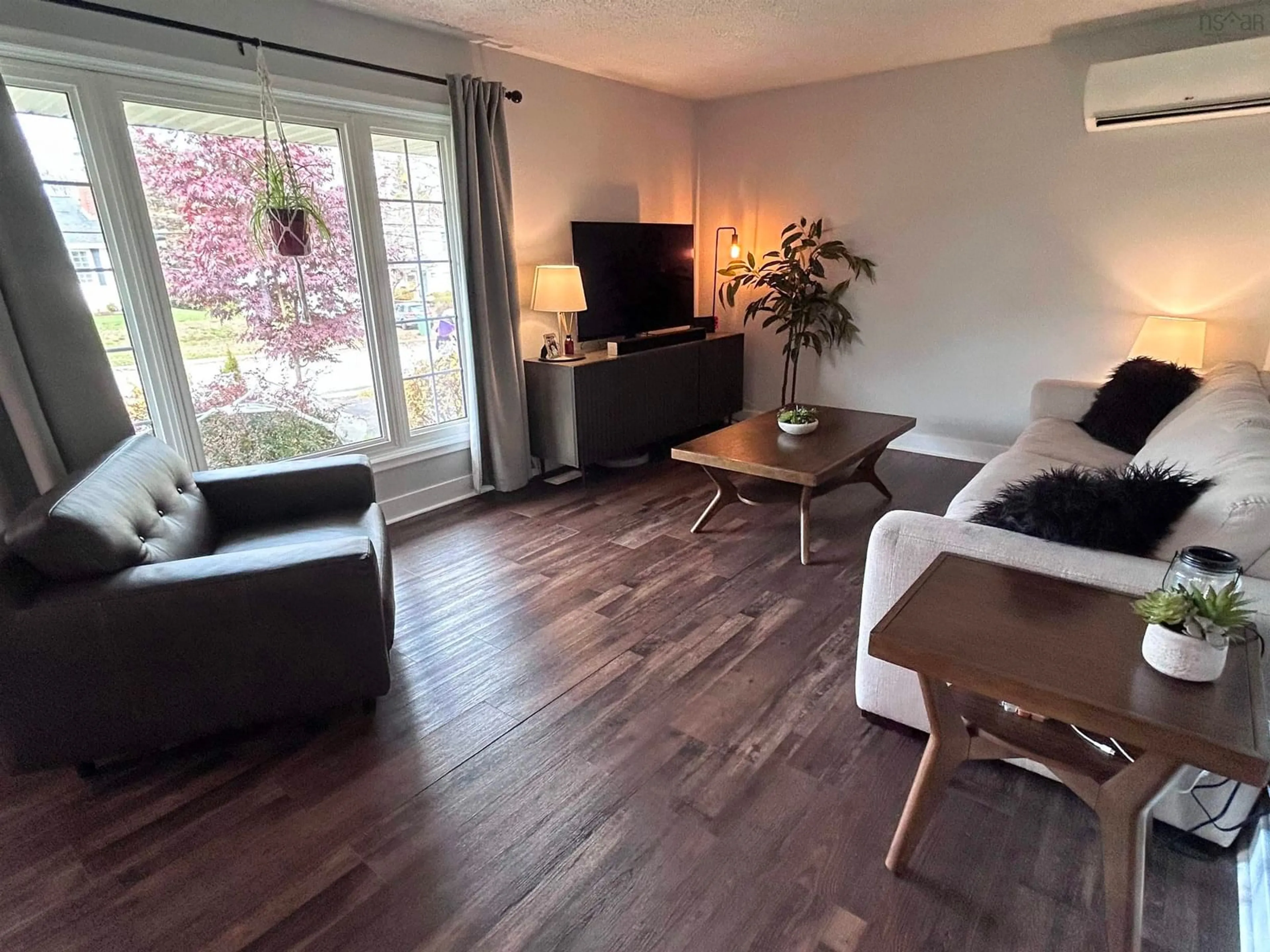 Living room with furniture, wood/laminate floor for 32 Lawson Ave, Dartmouth Nova Scotia B2W 2Z3