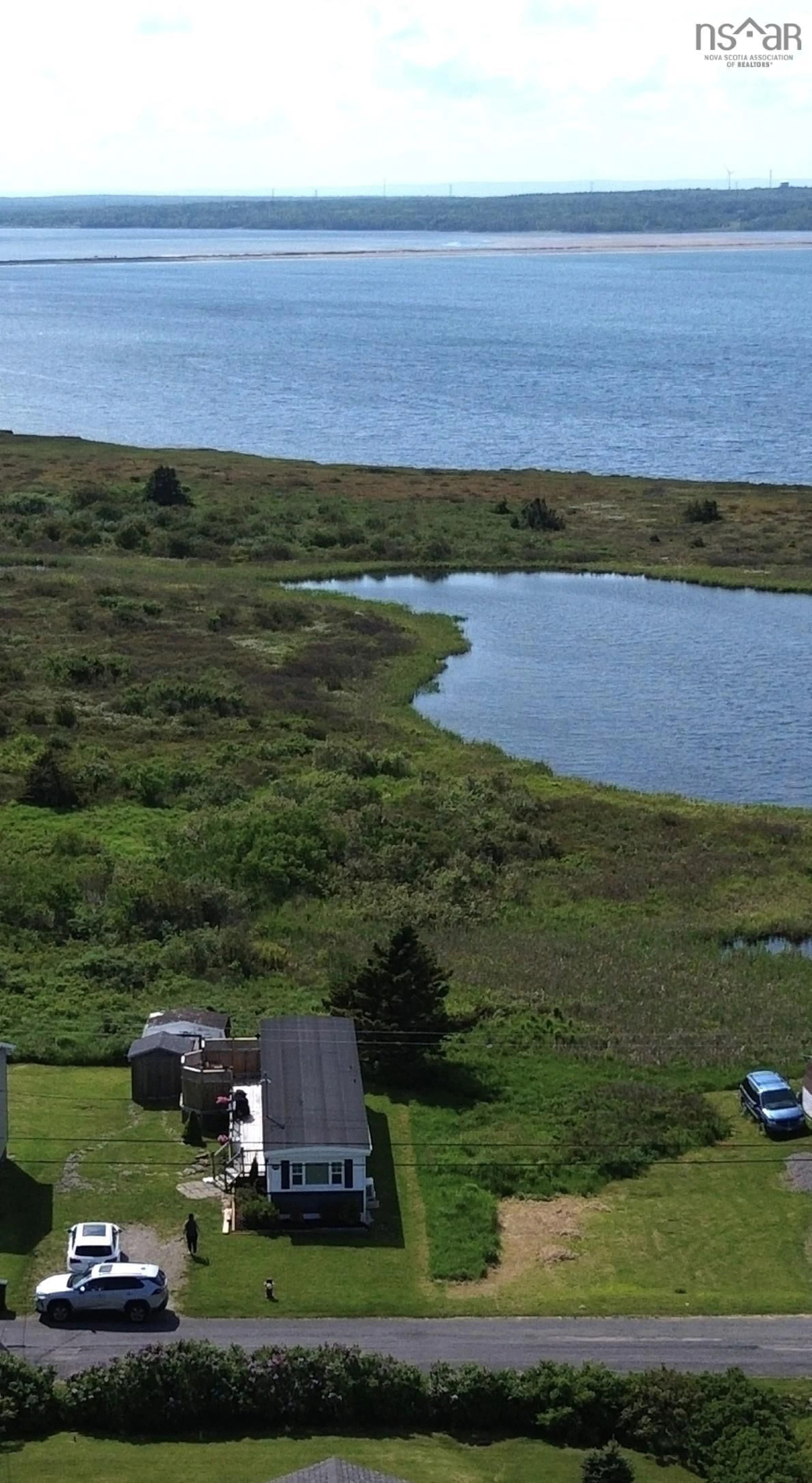 A pic from outside/outdoor area/front of a property/back of a property/a pic from drone, water/lake/river/ocean view for 127 Park St, Dominion Nova Scotia B1G 1R7