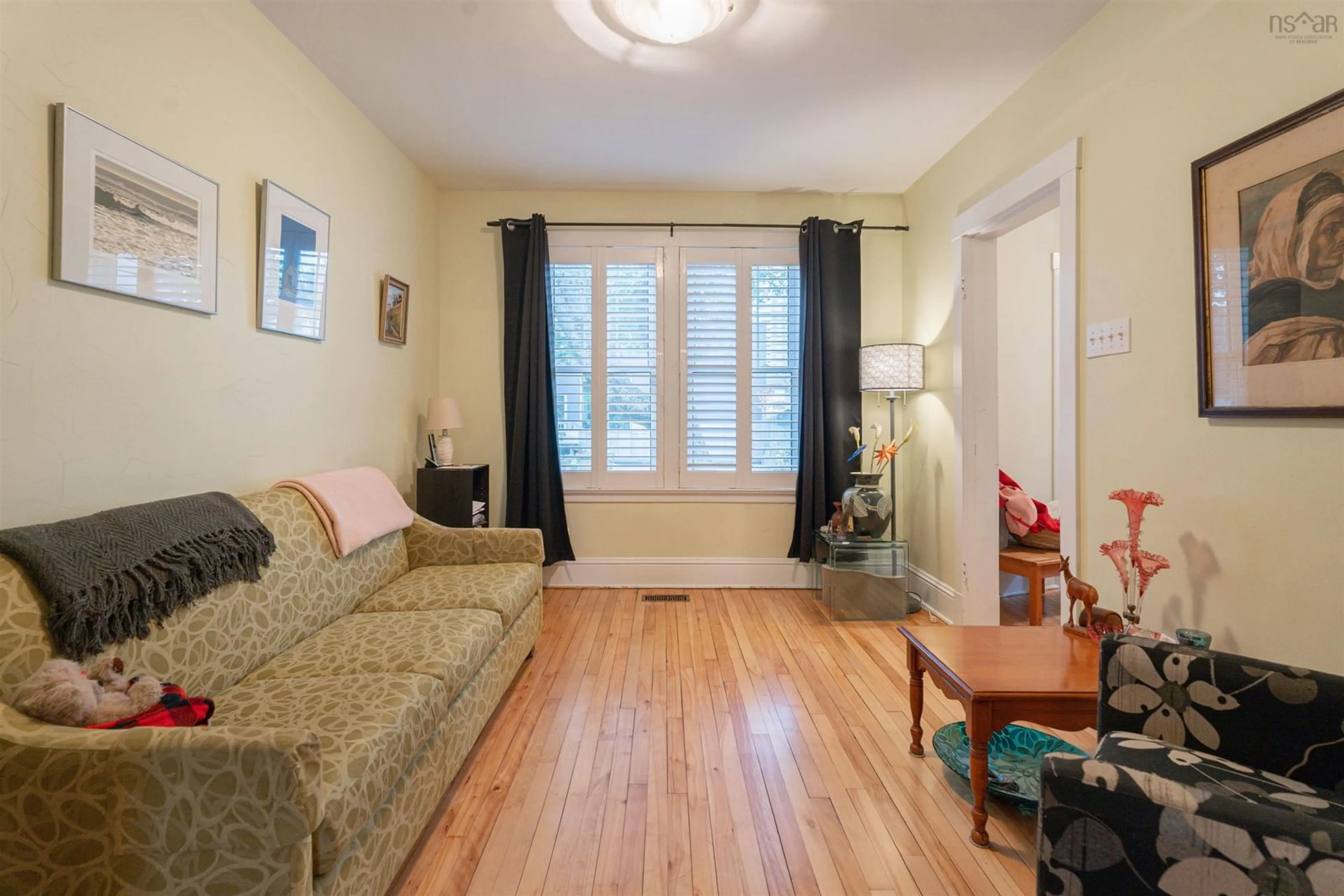 Living room with furniture, wood/laminate floor for 5865 Kane St, Halifax Nova Scotia B3K 2B6