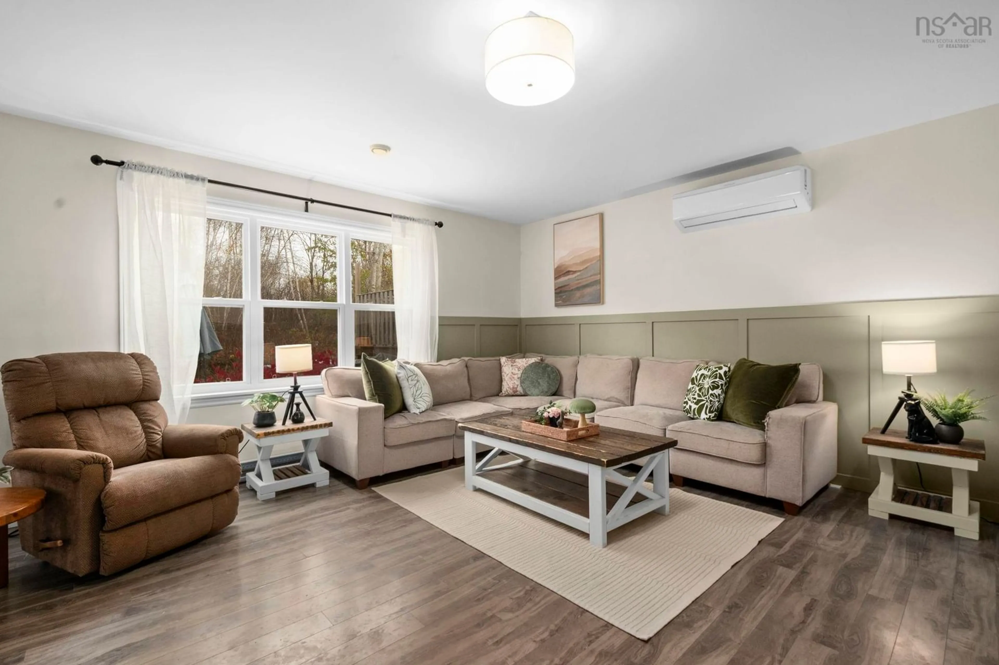 Living room with furniture, wood/laminate floor for 58 Underwood Rd, Garlands Crossing Nova Scotia B0N 2T0