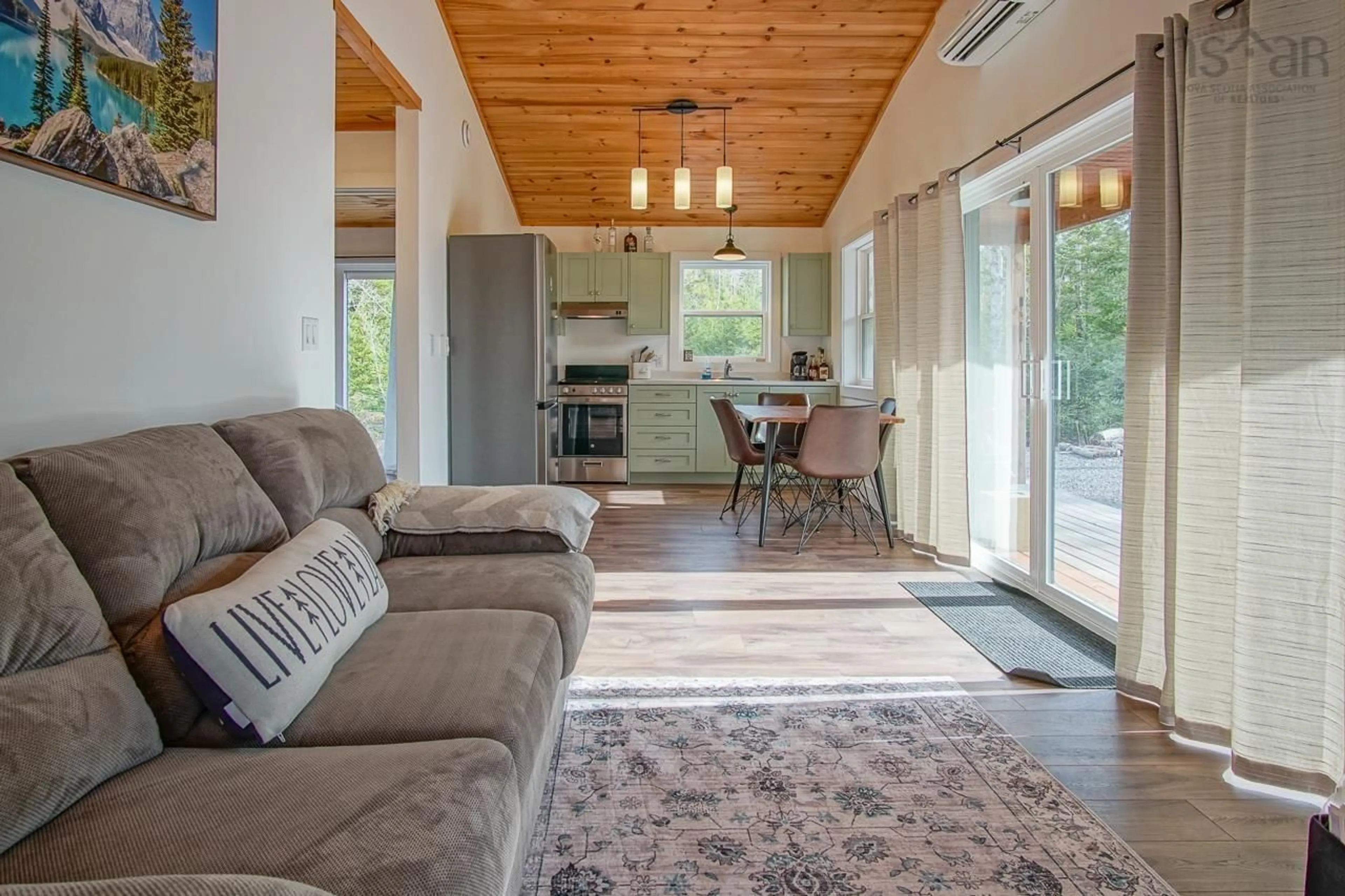 Living room with furniture, wood/laminate floor for 366 Loon Lake Dr, Lake Paul Nova Scotia B0P 1C0