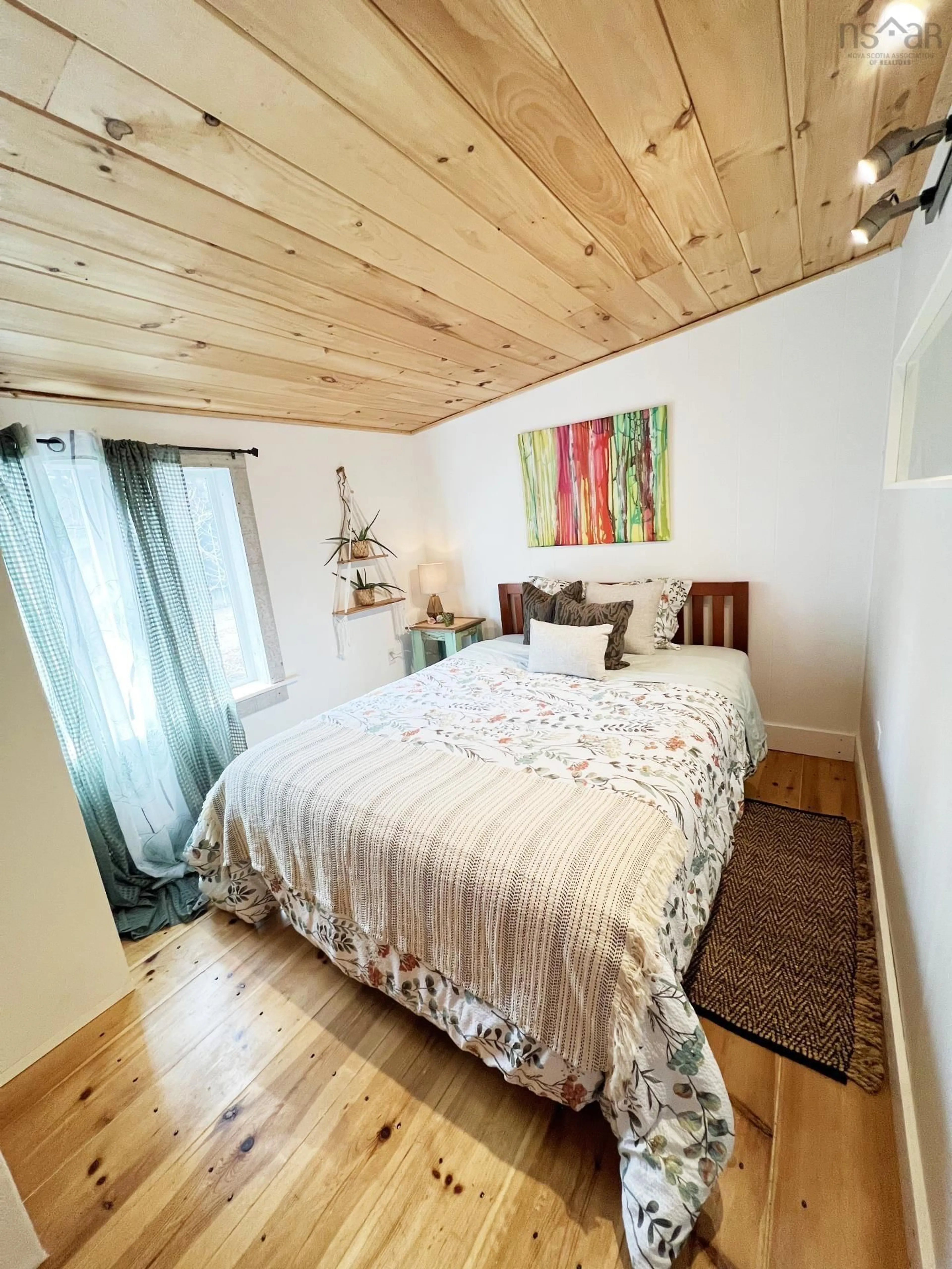 Bedroom with bed, wood/laminate floor for 8848 St Margarets Bay Rd, Queensland Nova Scotia B0J 1T0