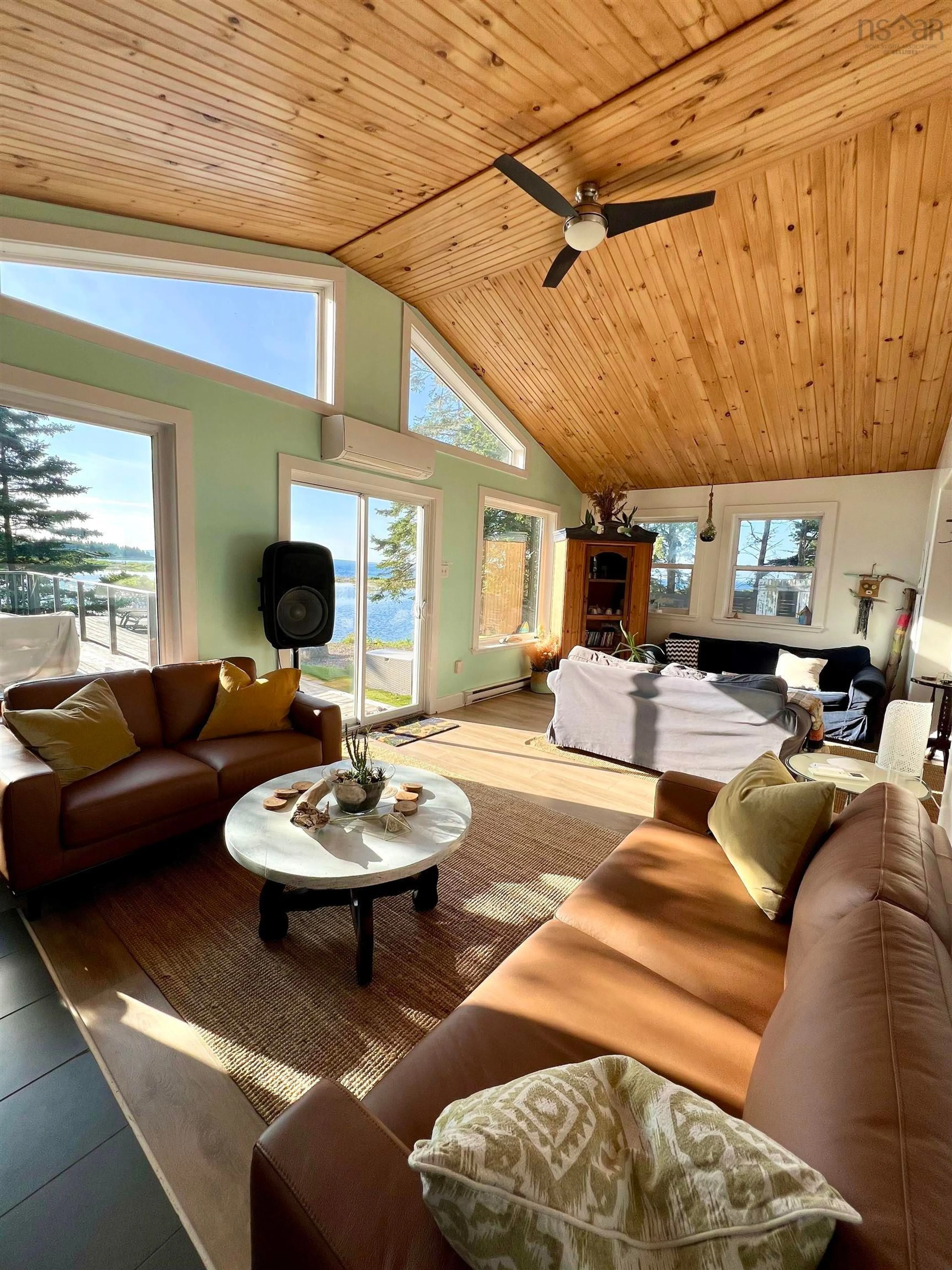Living room with furniture, wood/laminate floor for 8856 St Margarets Bay Rd, Queensland Nova Scotia B0J 1T0