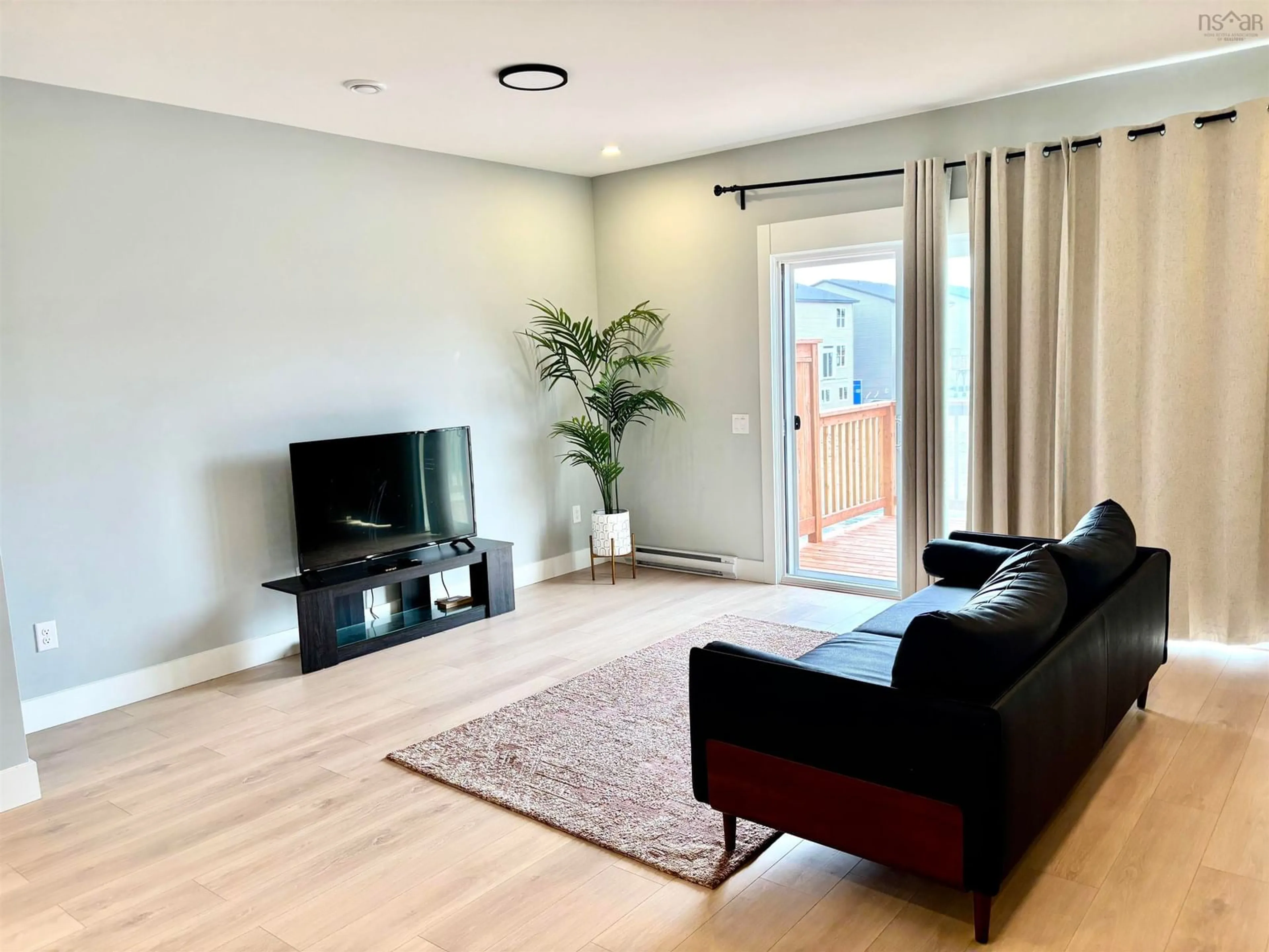 Living room with furniture, wood/laminate floor for 78 Honeygold Dr, Halifax Nova Scotia B3R 0G2