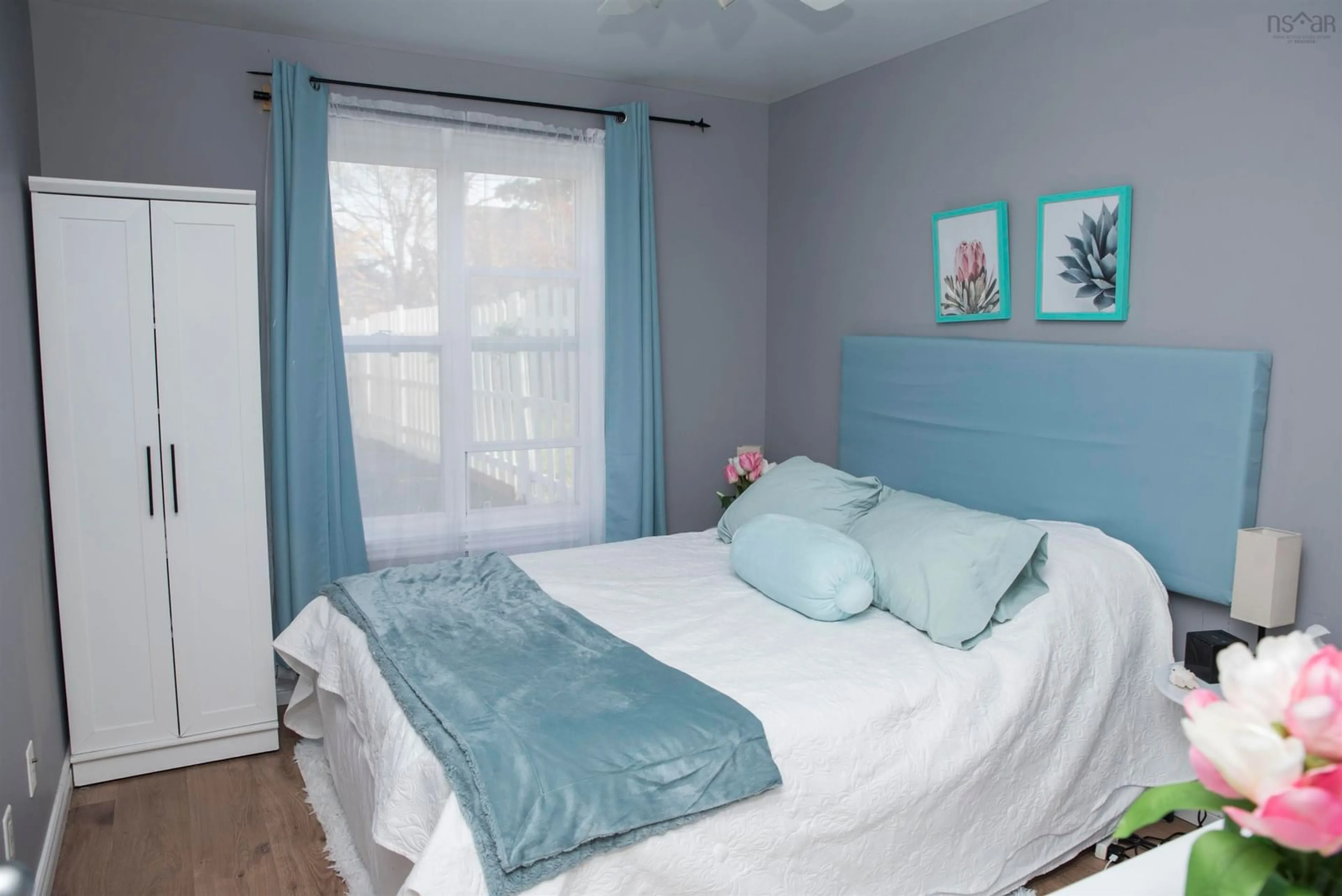 Bedroom with bed, wood/laminate floor for 20 Thomas St, Sydney Nova Scotia B1S 2R3