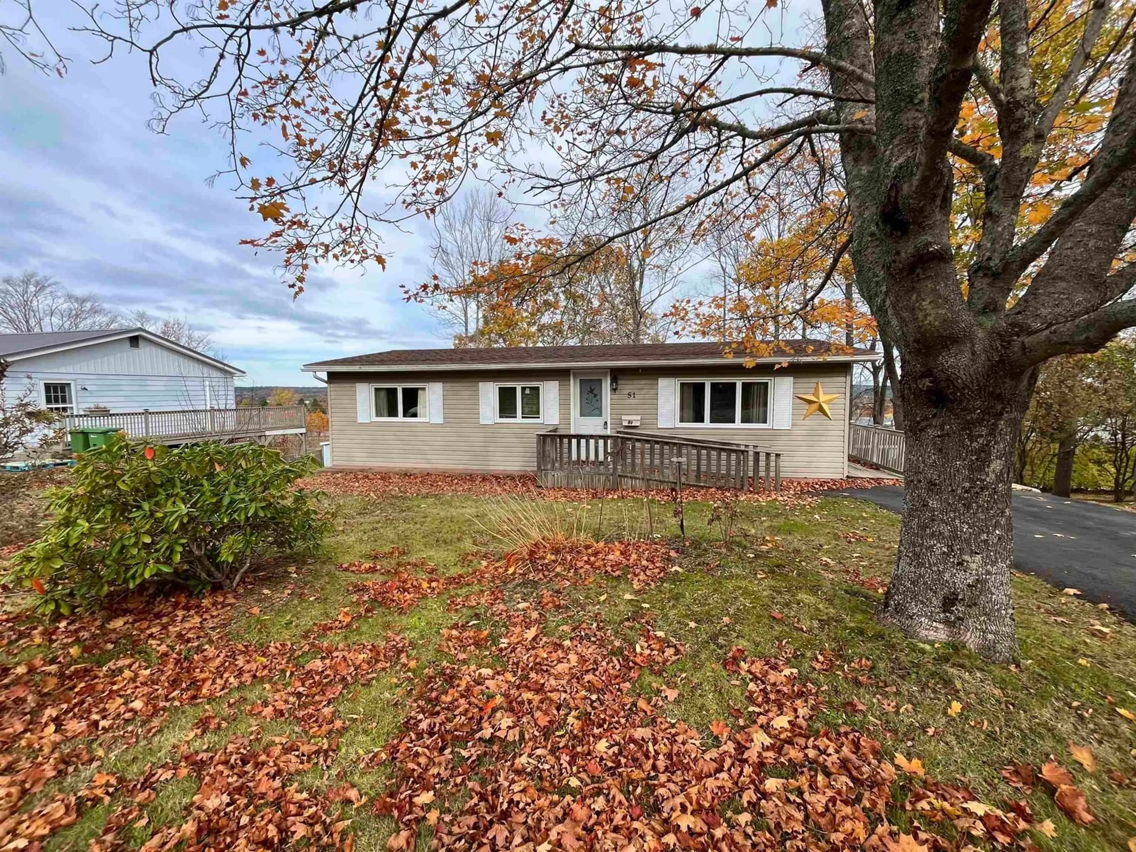 A pic from outside/outdoor area/front of a property/back of a property/a pic from drone, unknown for 51 Micmac Ave, Bridgewater Nova Scotia B4V 1M3