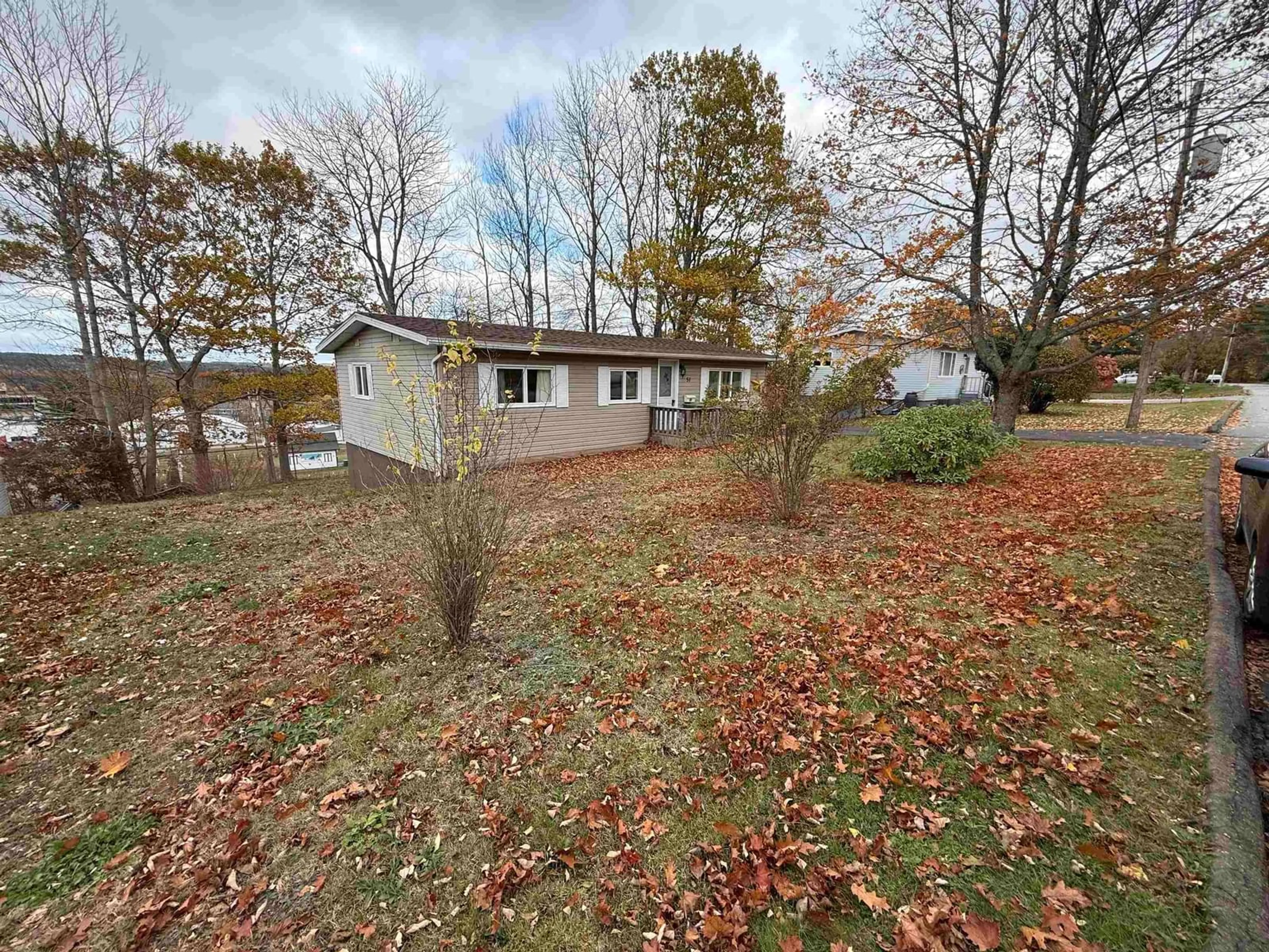 A pic from outside/outdoor area/front of a property/back of a property/a pic from drone, unknown for 51 Micmac Ave, Bridgewater Nova Scotia B4V 1M3