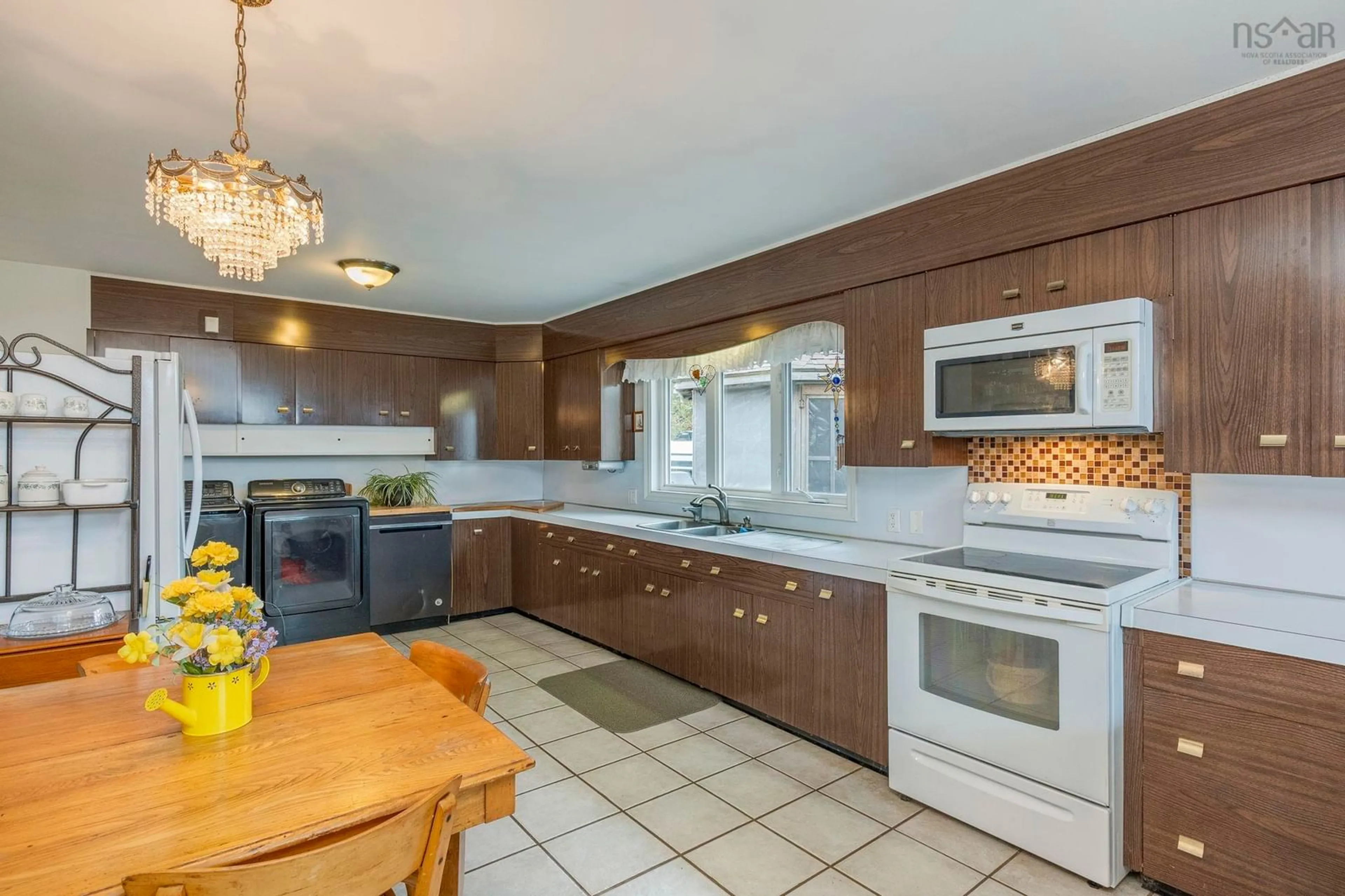 Open concept kitchen, ceramic/tile floor for 1358 Hwy 1, Church Point Nova Scotia B0W 1M0