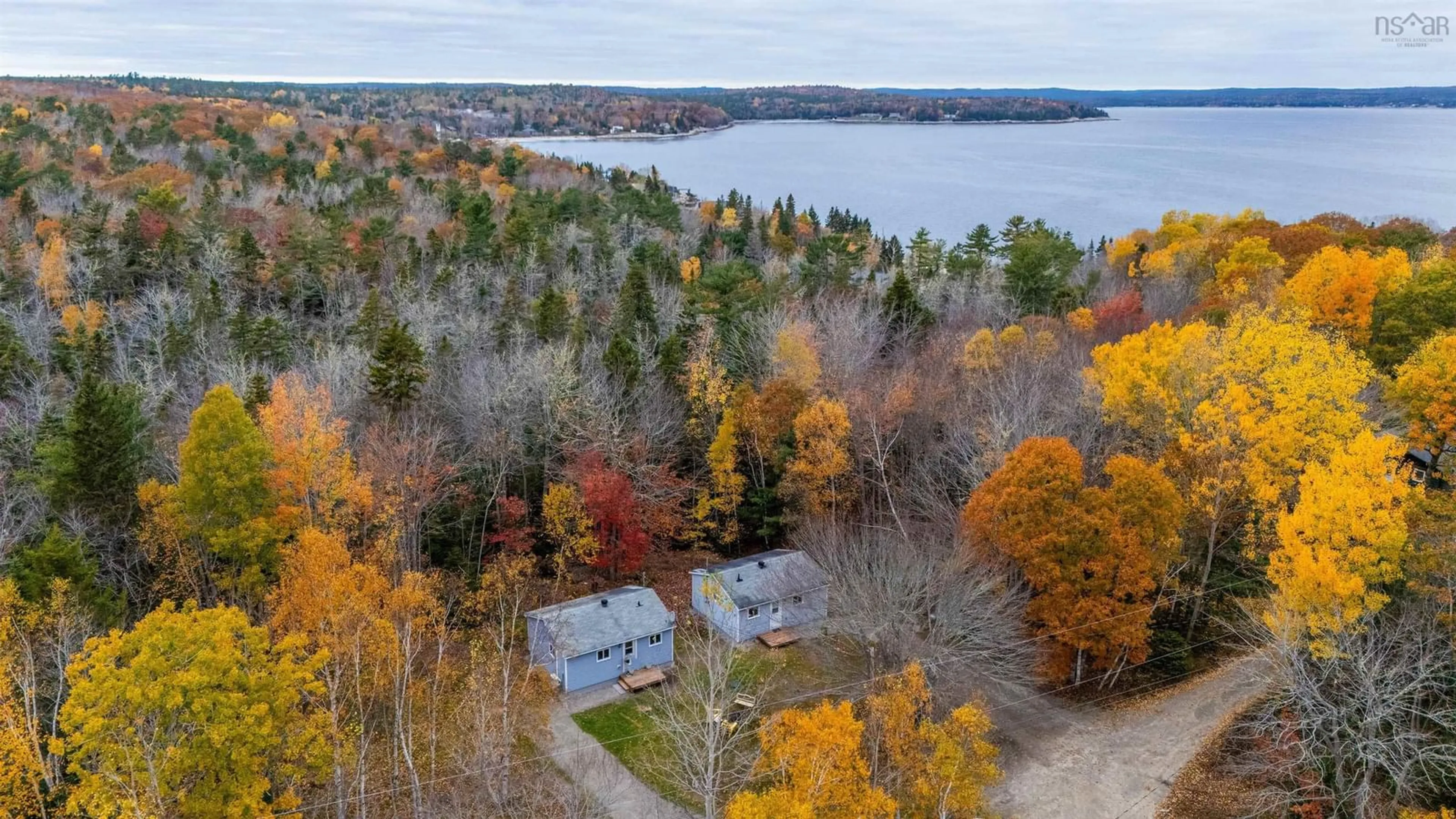 A pic from outside/outdoor area/front of a property/back of a property/a pic from drone, water/lake/river/ocean view for 40 Spruce Dr, Mill Cove Nova Scotia B0J 1T0