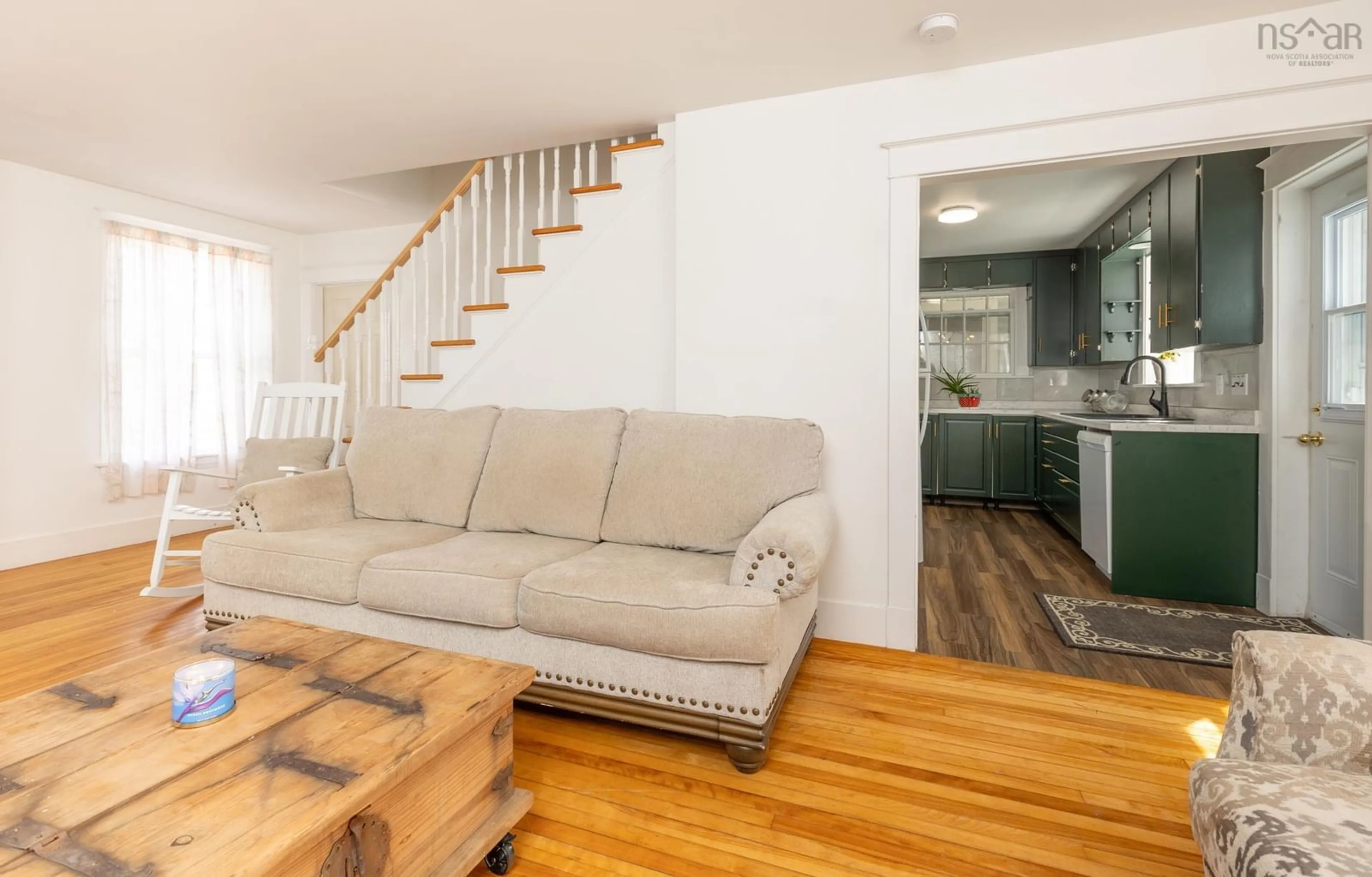 Living room with furniture, wood/laminate floor for 91 Cliff St, Yarmouth Nova Scotia B5A 3J7