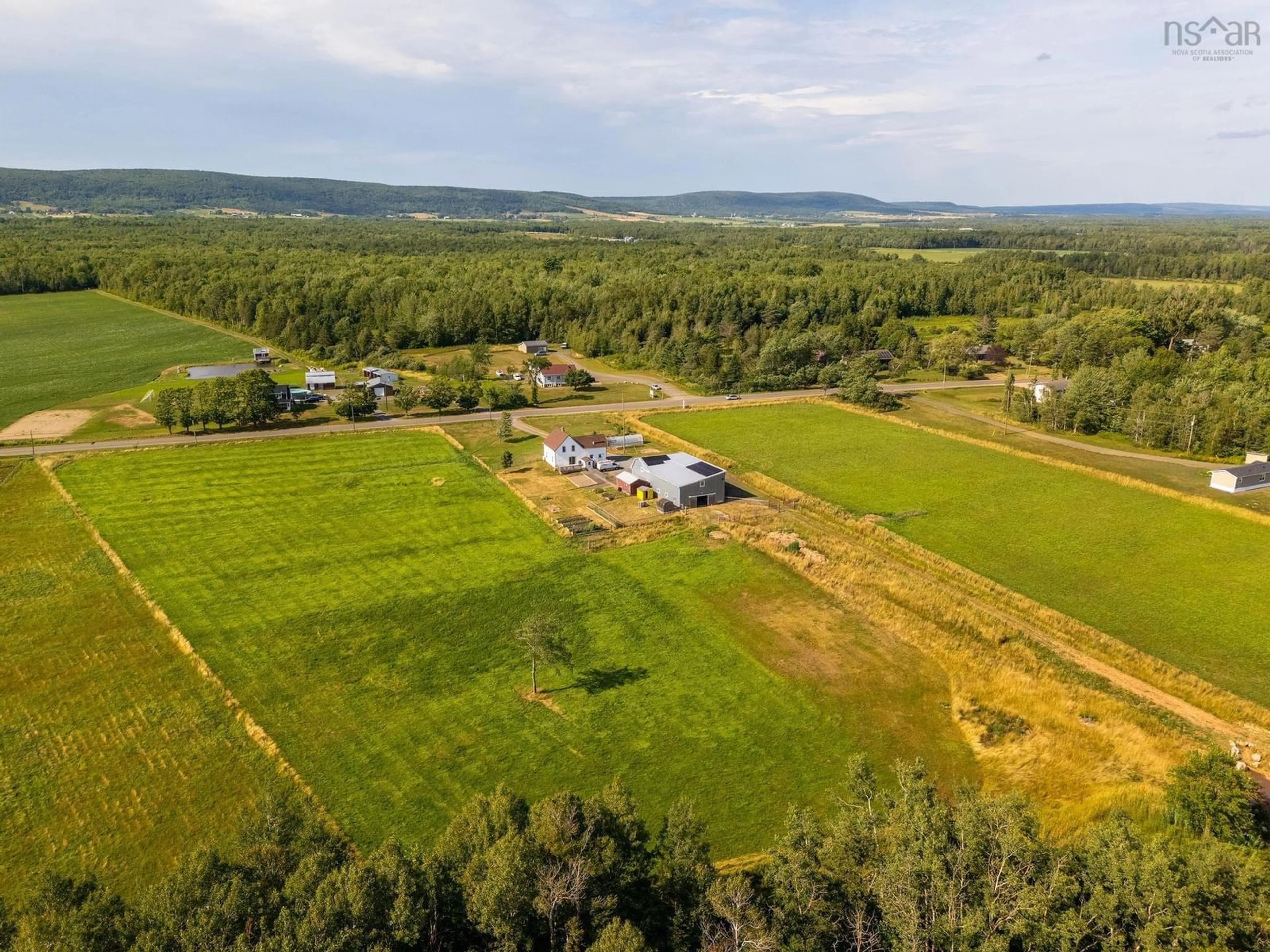 A pic from outside/outdoor area/front of a property/back of a property/a pic from drone, mountain view for 710 Main Street, Lawrencetown Nova Scotia B0S 1M0