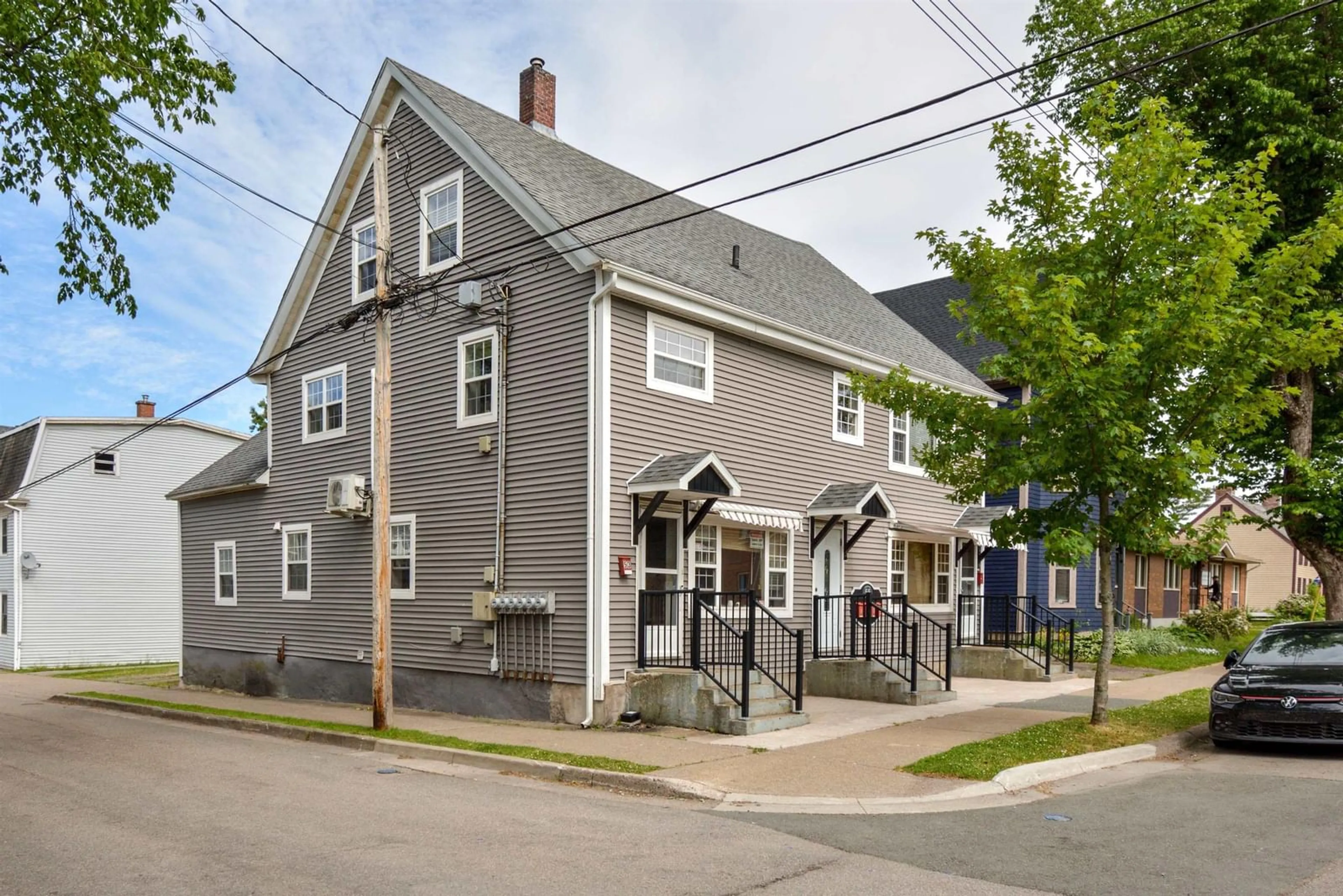 Home with vinyl exterior material, street for 55 Charlotte St, Sydney Nova Scotia B1P 1B8