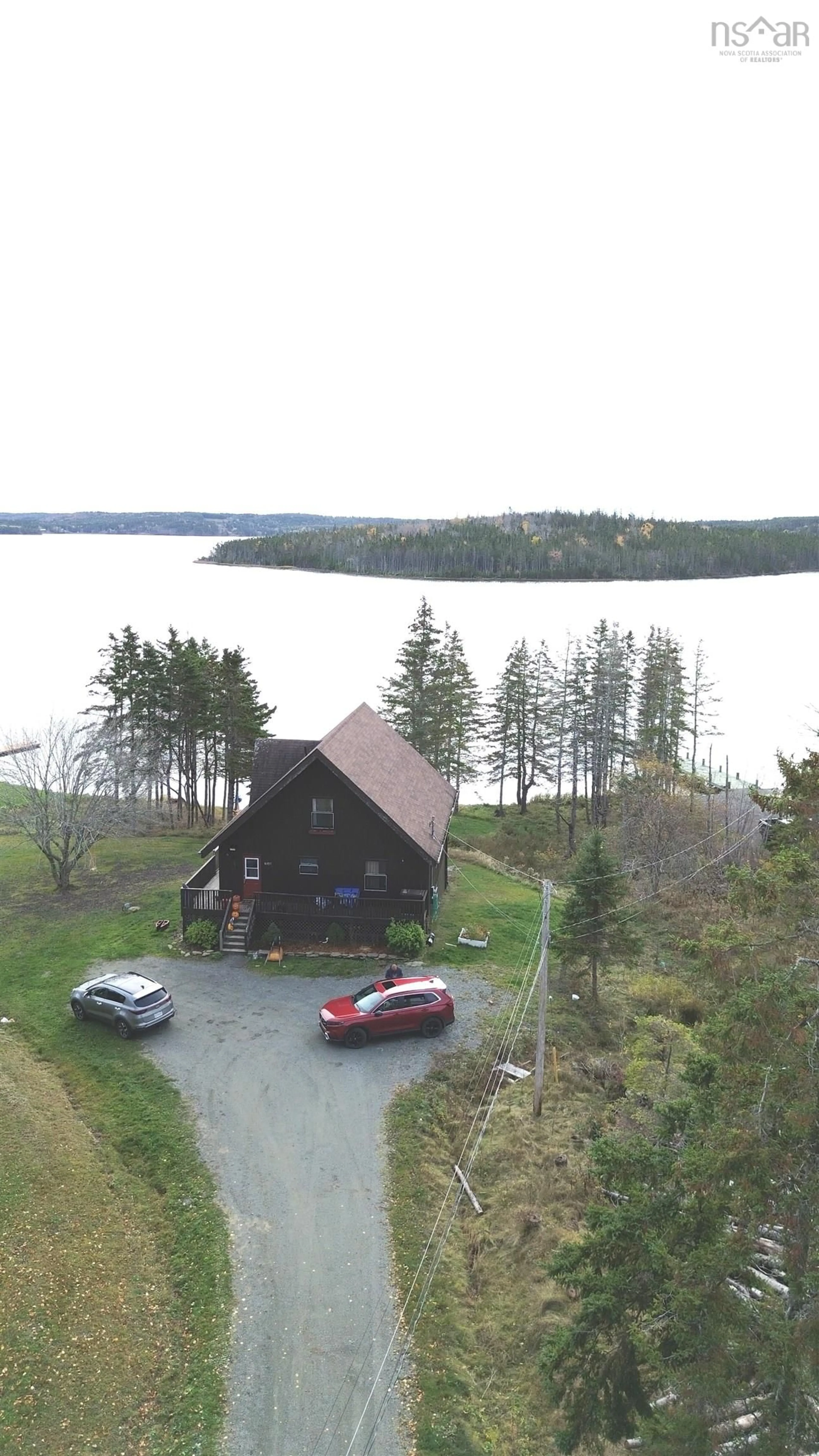A pic from outside/outdoor area/front of a property/back of a property/a pic from drone, water/lake/river/ocean view for 8937 Pepperell St, St. Peter's Nova Scotia B0E 3B0