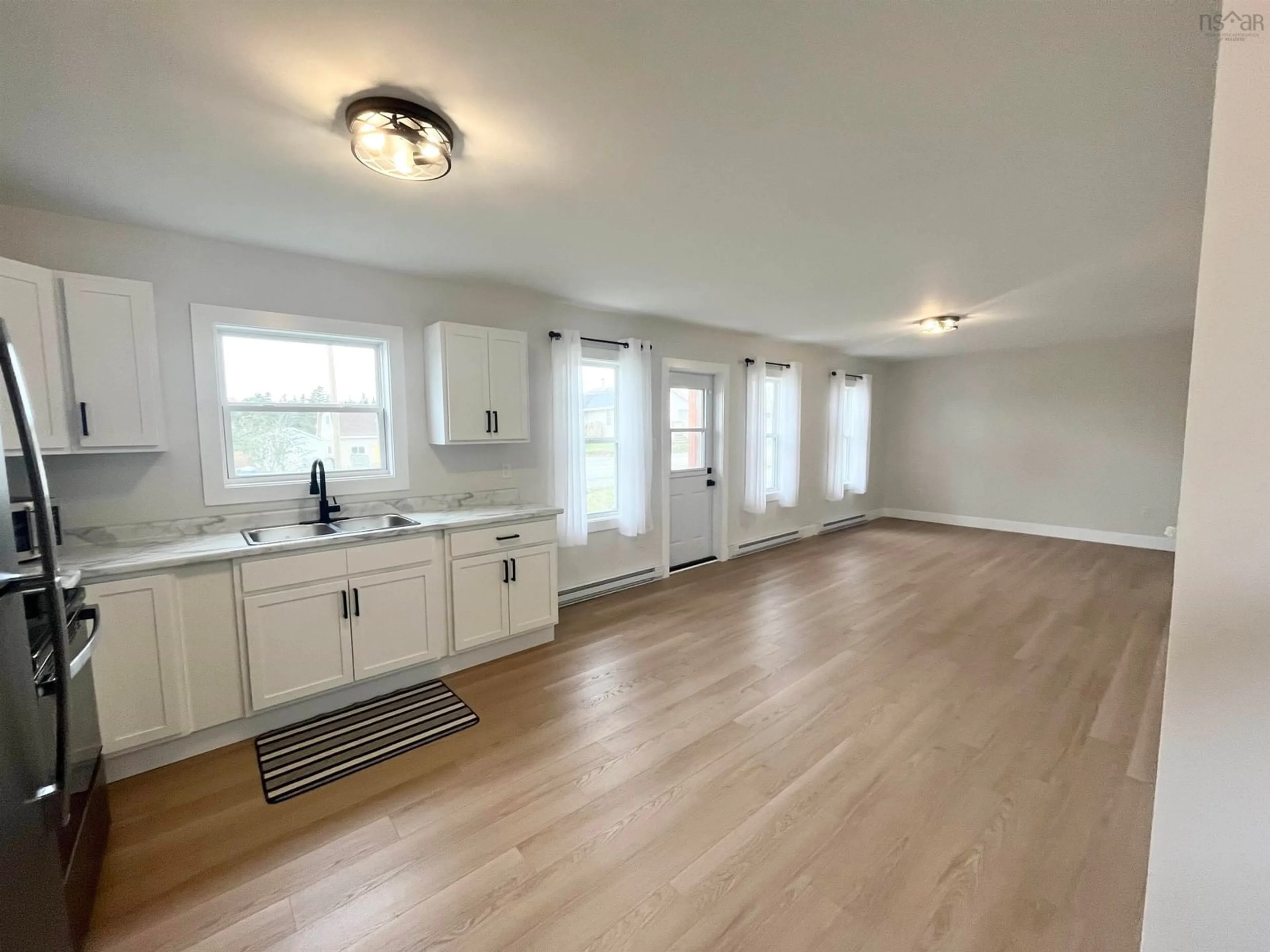 Open concept kitchen, wood/laminate floor for 1878 Highway 330, Newellton Nova Scotia B0W 1P0