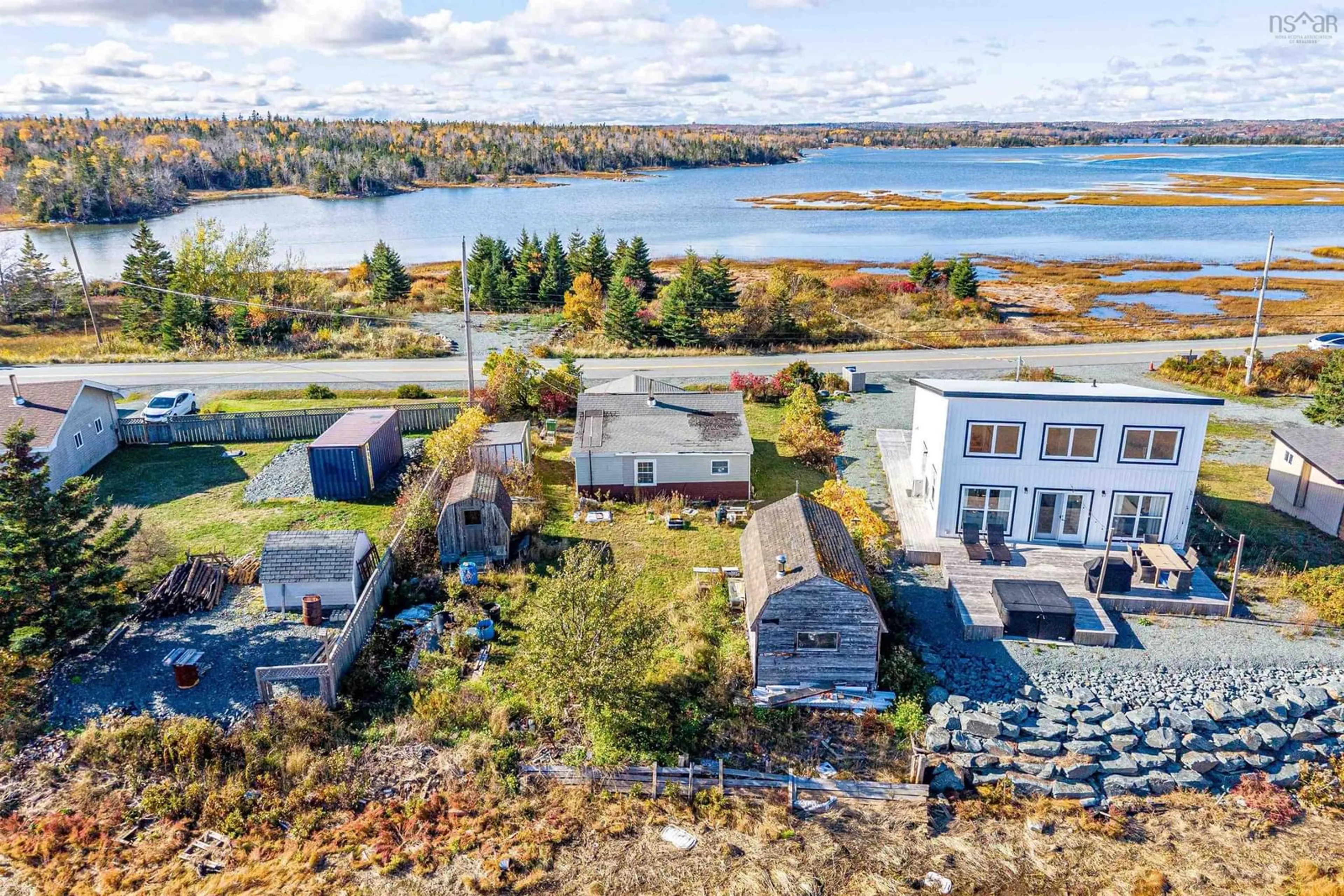 A pic from outside/outdoor area/front of a property/back of a property/a pic from drone, water/lake/river/ocean view for 2327 Cow Bay Rd, Cow Bay Nova Scotia B3G 1K8