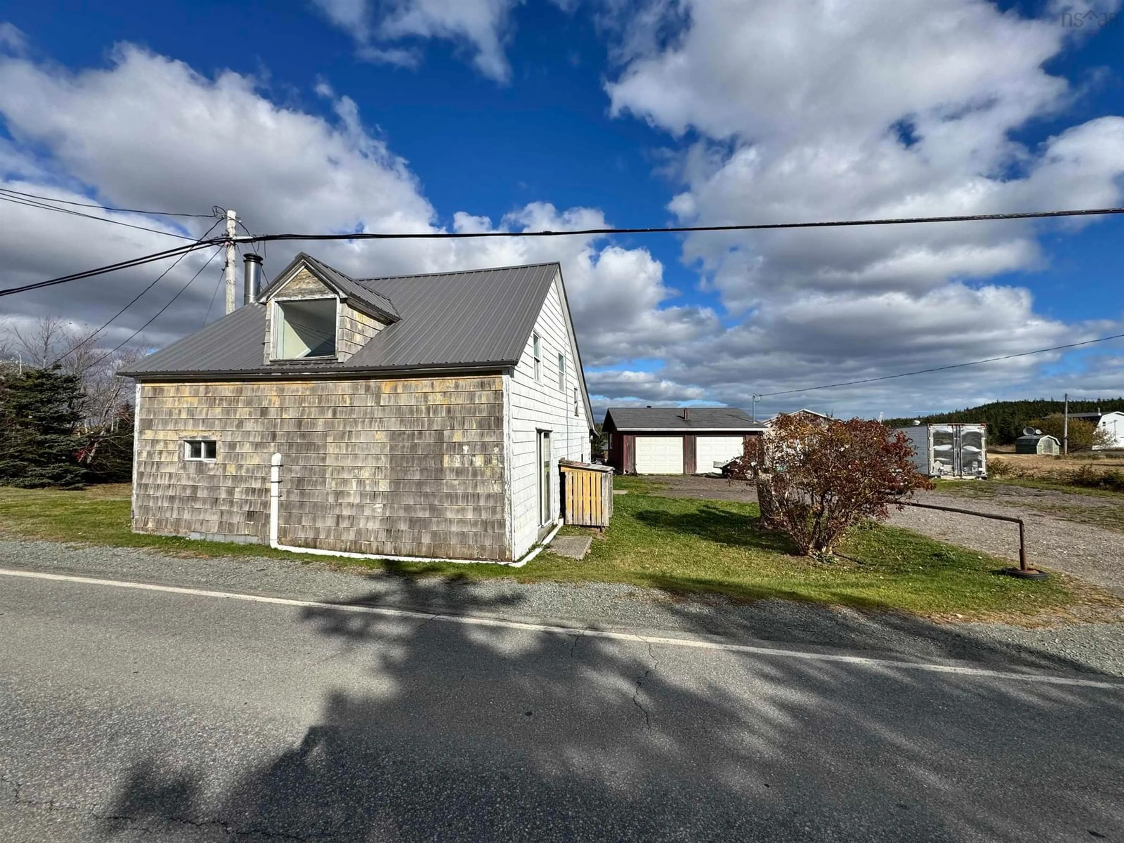 A pic from outside/outdoor area/front of a property/back of a property/a pic from drone, street for 1587 Highway 206, West Arichat Nova Scotia B0E 3J0