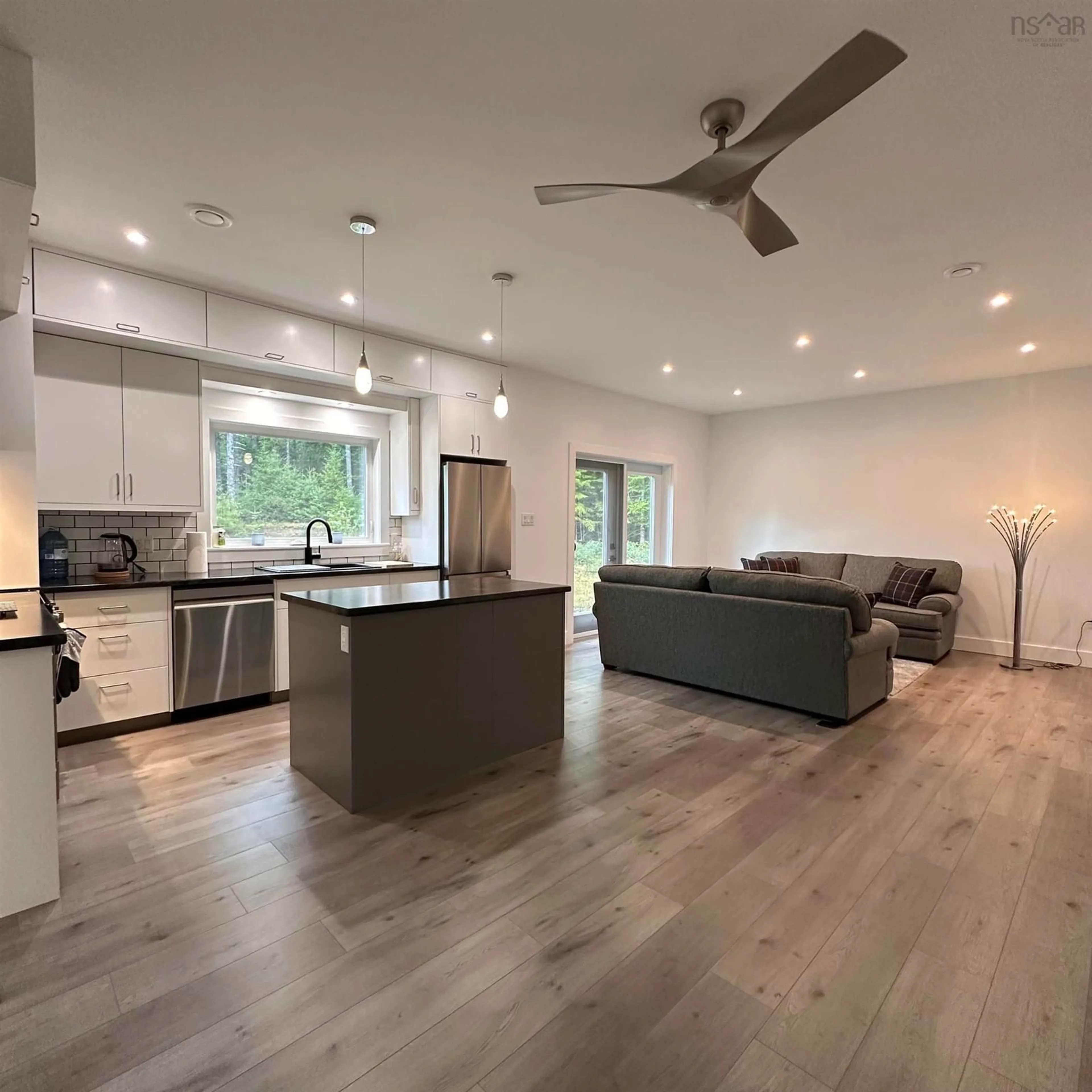 Open concept kitchen, wood/laminate floor for 75 Danica Dr, Pine Grove Nova Scotia B4V 7Z2