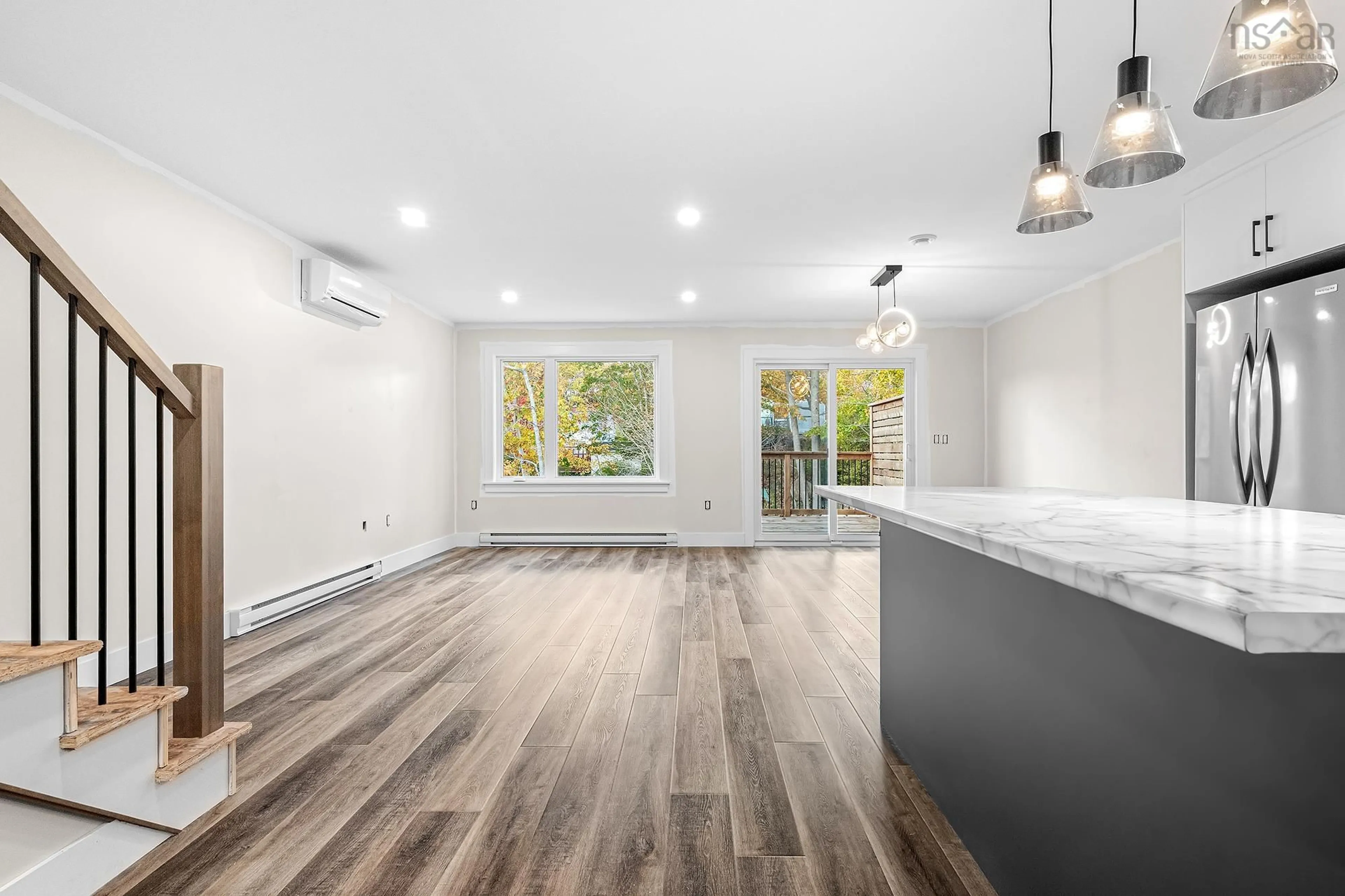 Open concept kitchen, wood/laminate floor for 25B Spry Ave, Spryfield Nova Scotia B3P 1X1
