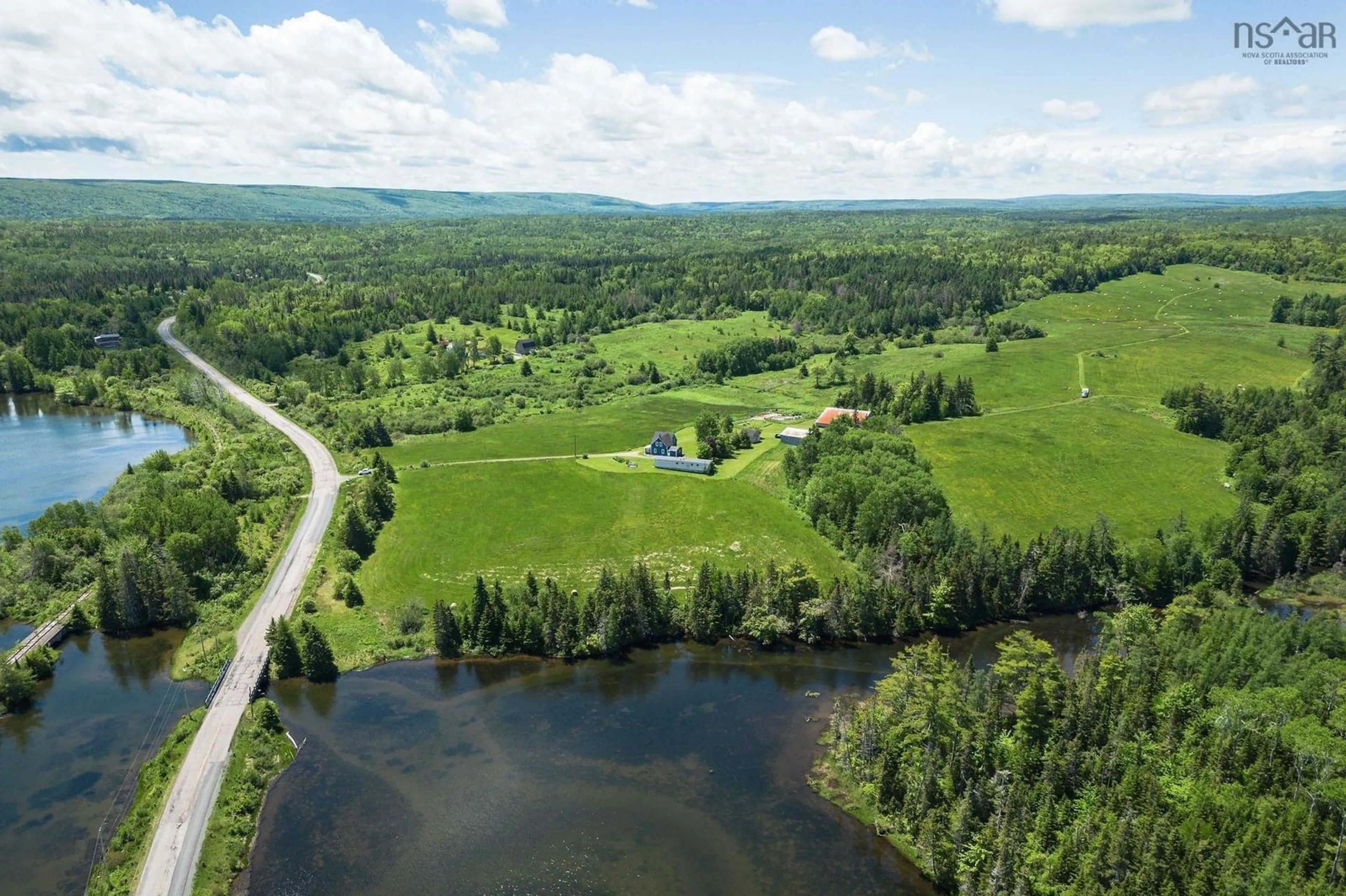 A pic from outside/outdoor area/front of a property/back of a property/a pic from drone, water/lake/river/ocean view for 10353 Marble Mountain Rd, Orangedale Nova Scotia B0E 2K0
