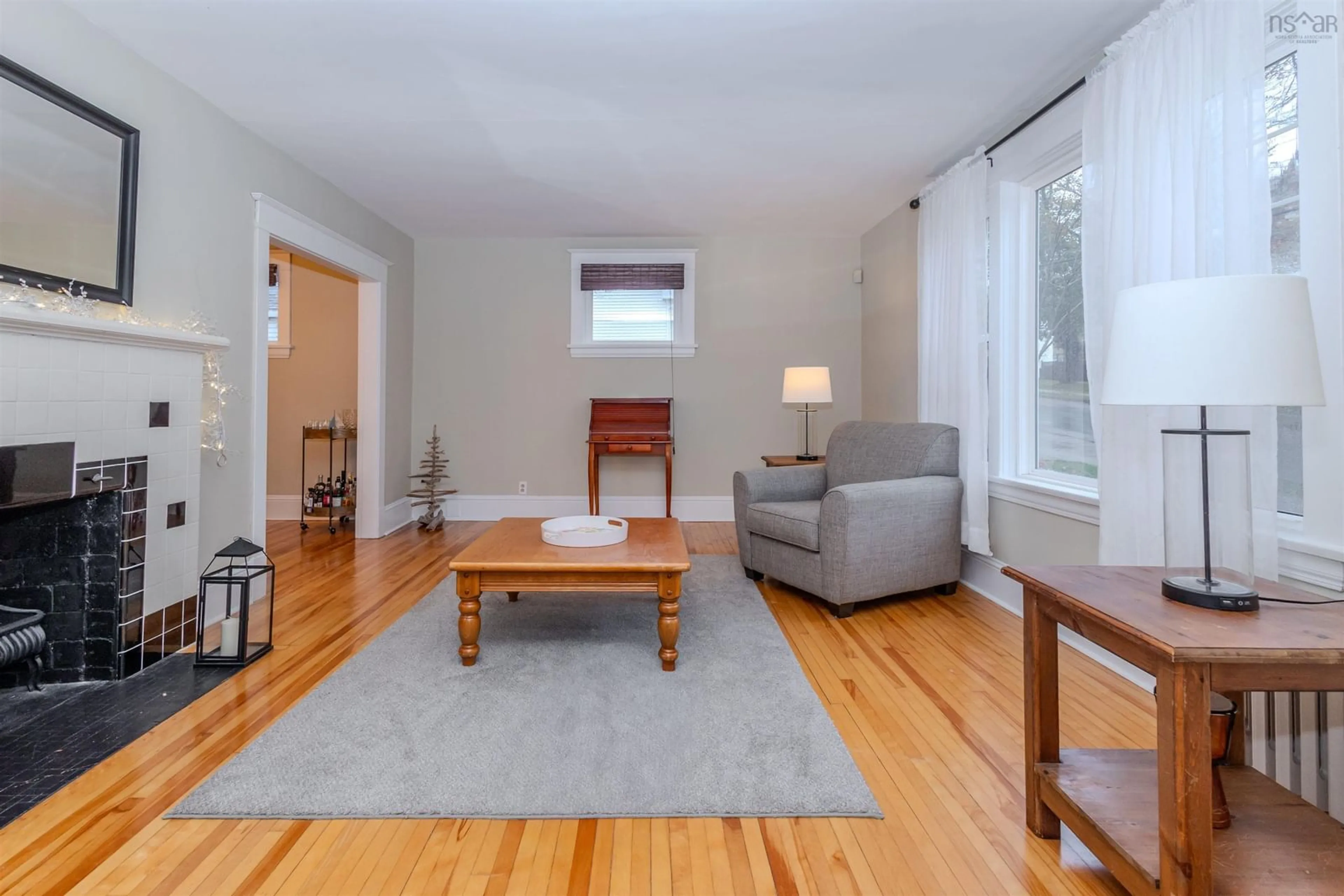 Living room with furniture, wood/laminate floor for 149 St Peters Rd, Sydney Nova Scotia B1P 4P7