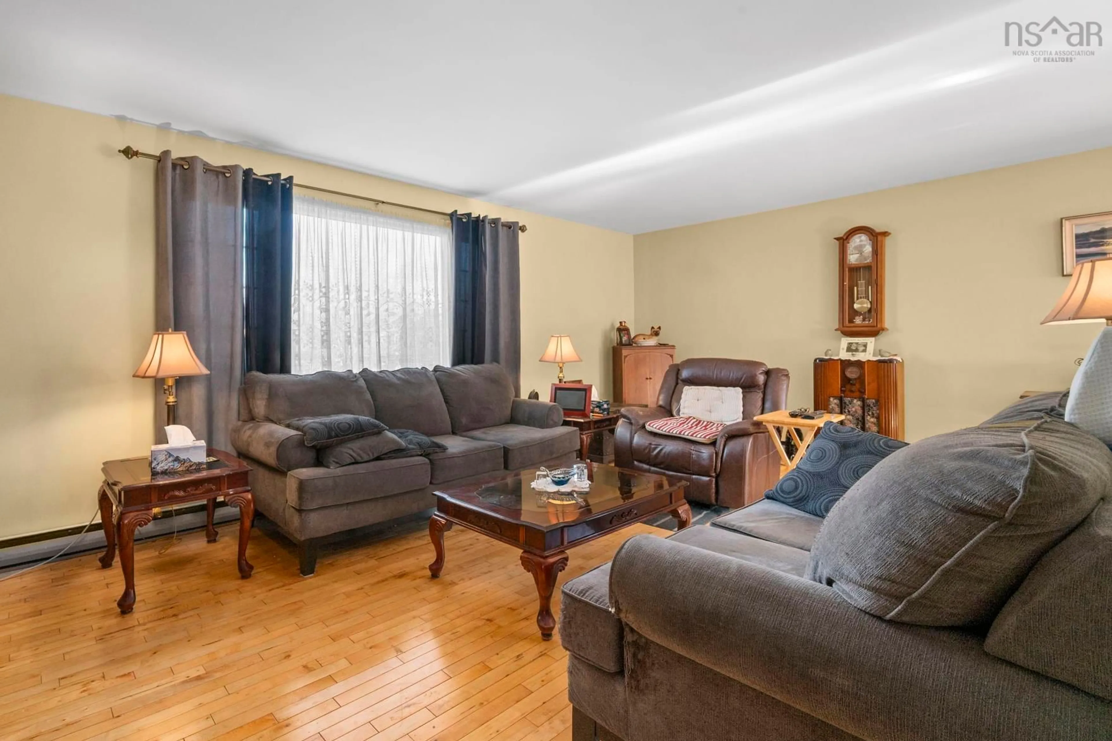 Living room with furniture, wood/laminate floor for 4 Kingsmere Crt, Timberlea Nova Scotia B3T 1J4