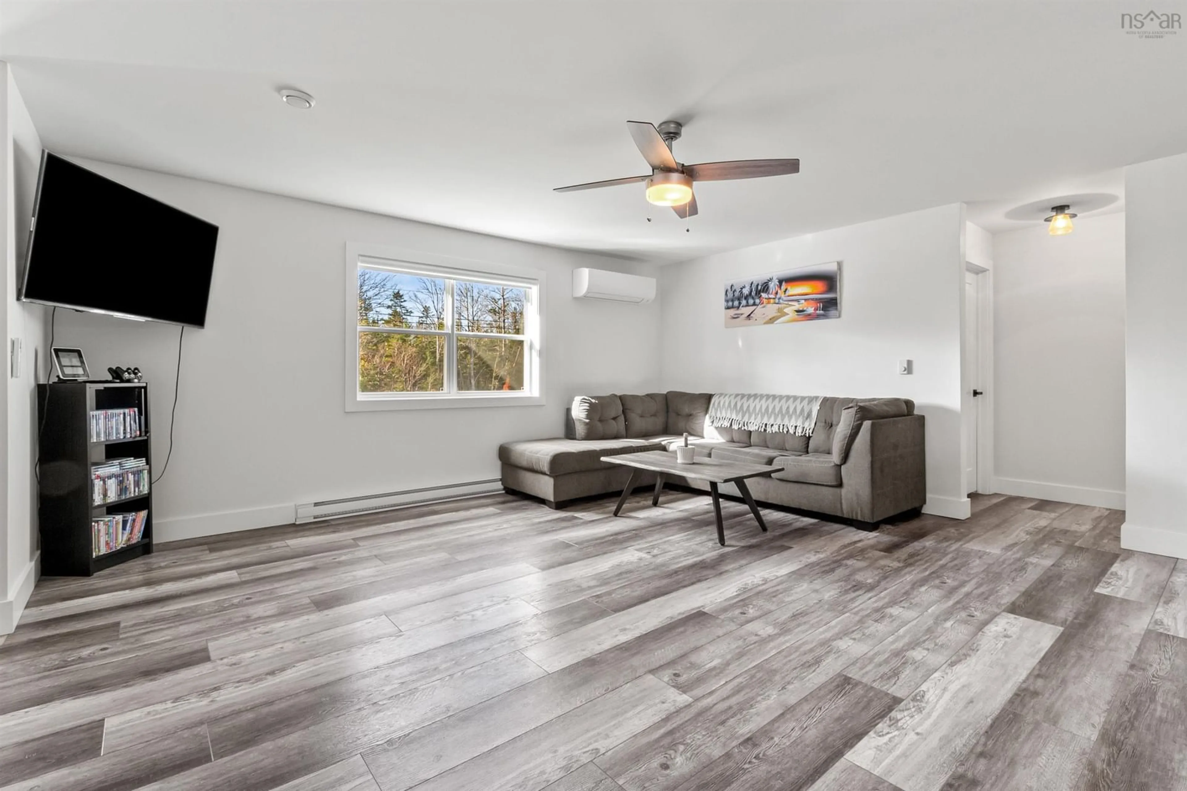 Living room with furniture, wood/laminate floor for 215 Grono Rd, Dutch Settlement Nova Scotia B2S 2H6