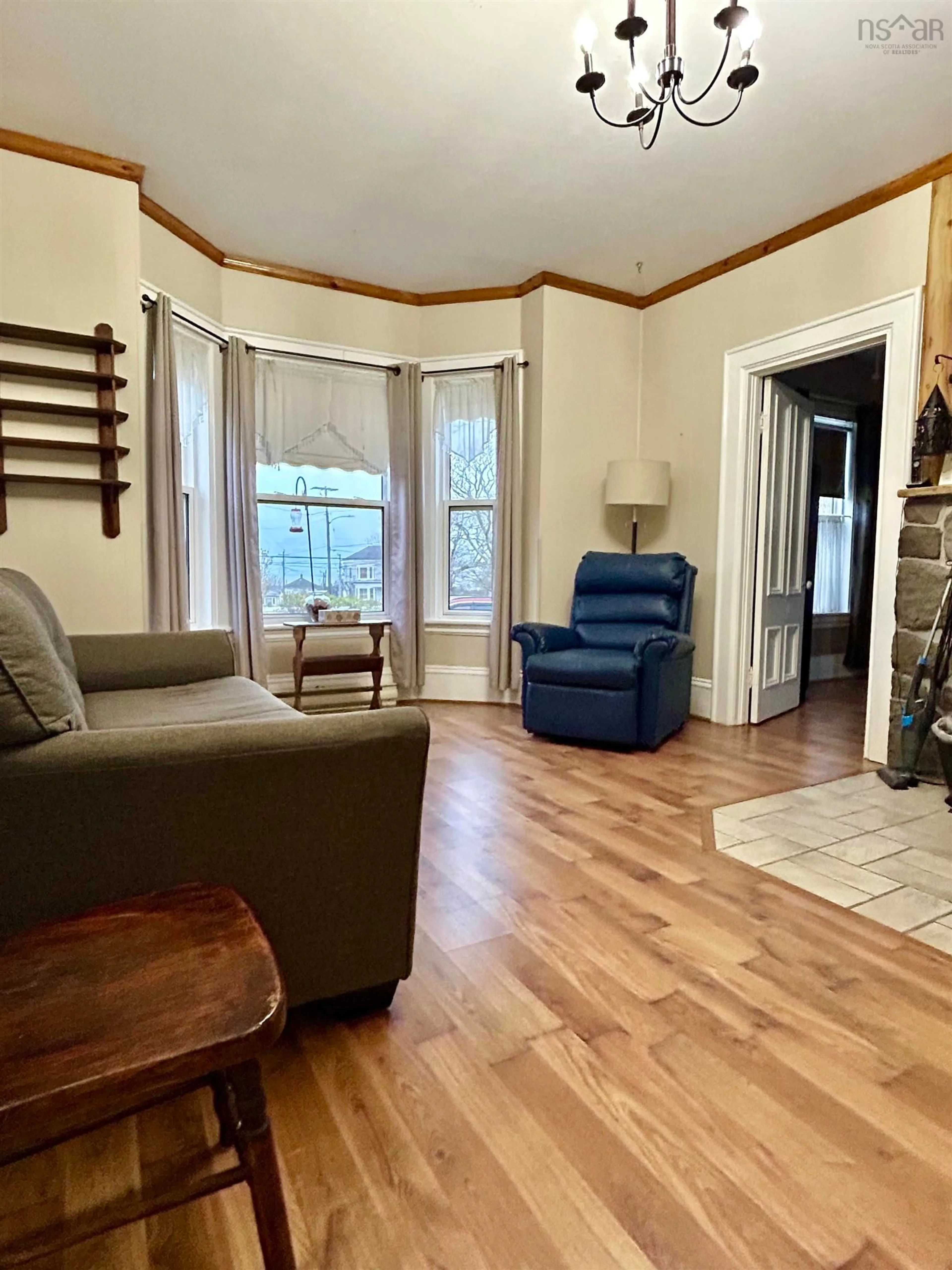 Living room with furniture, wood/laminate floor for 12 Hector St, Port Maitland Nova Scotia B5A 5R8