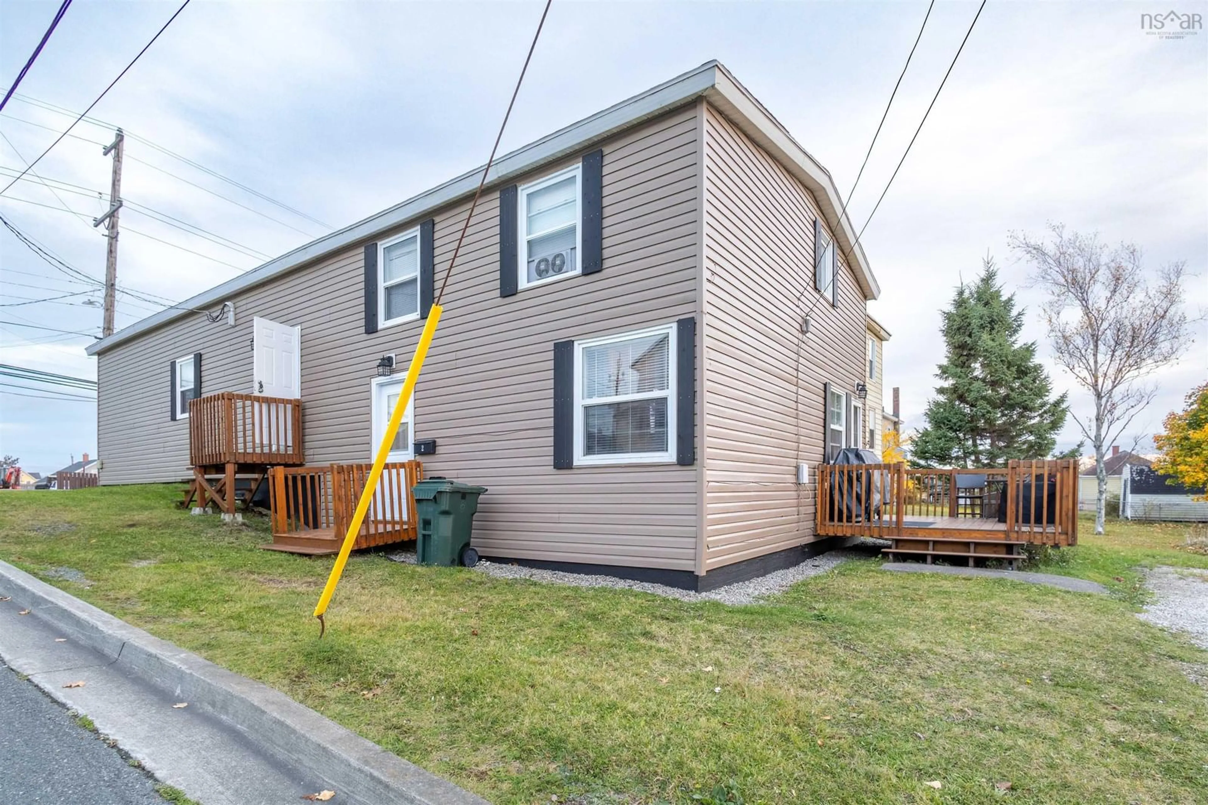 Home with vinyl exterior material, street for 253 Lingan Rd, Sydney Nova Scotia B1N 1V9