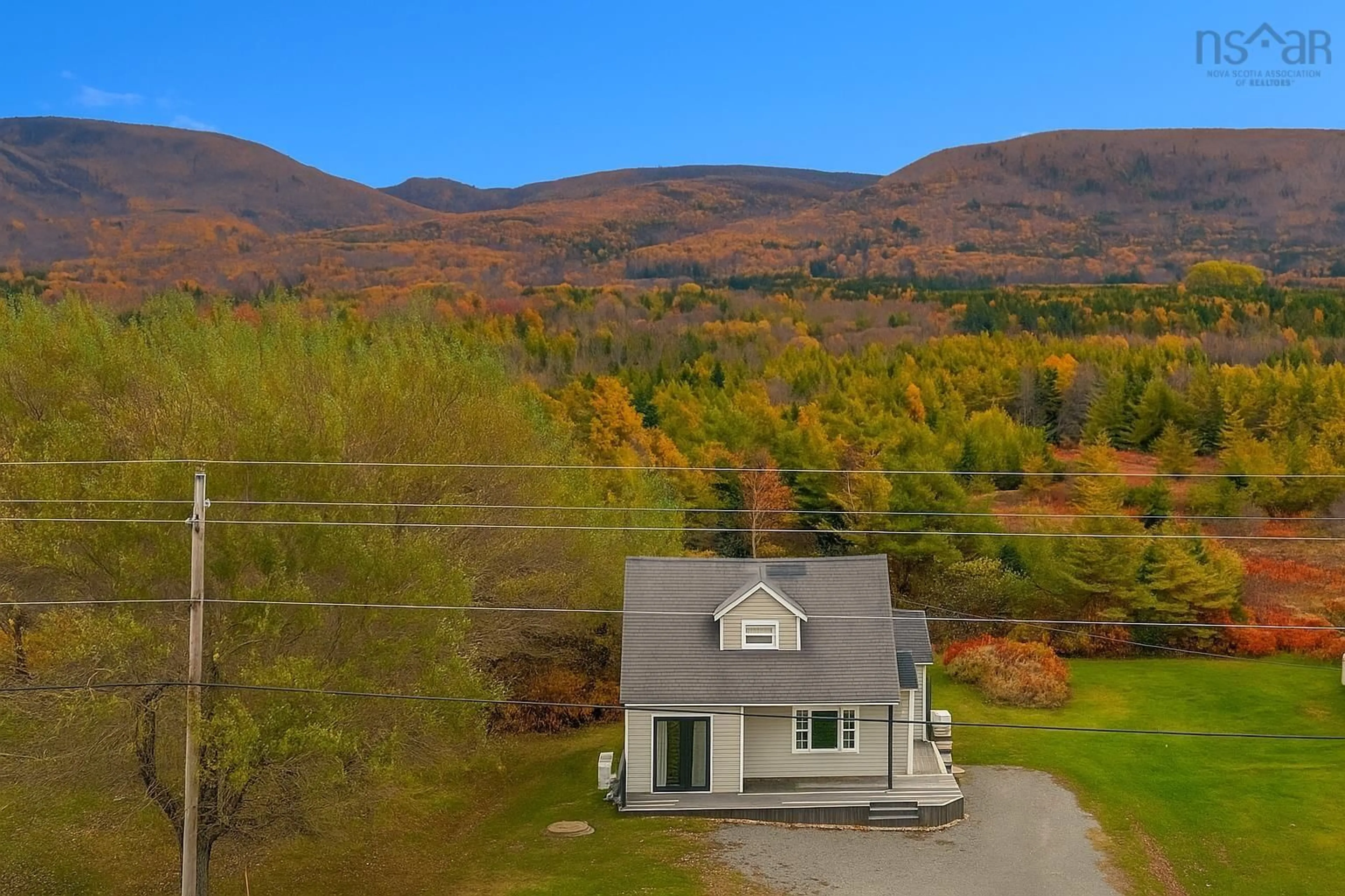 A pic from outside/outdoor area/front of a property/back of a property/a pic from drone, mountain view for 12710 Cabot Trail Rd, Grand Étang Nova Scotia B0E 1L0