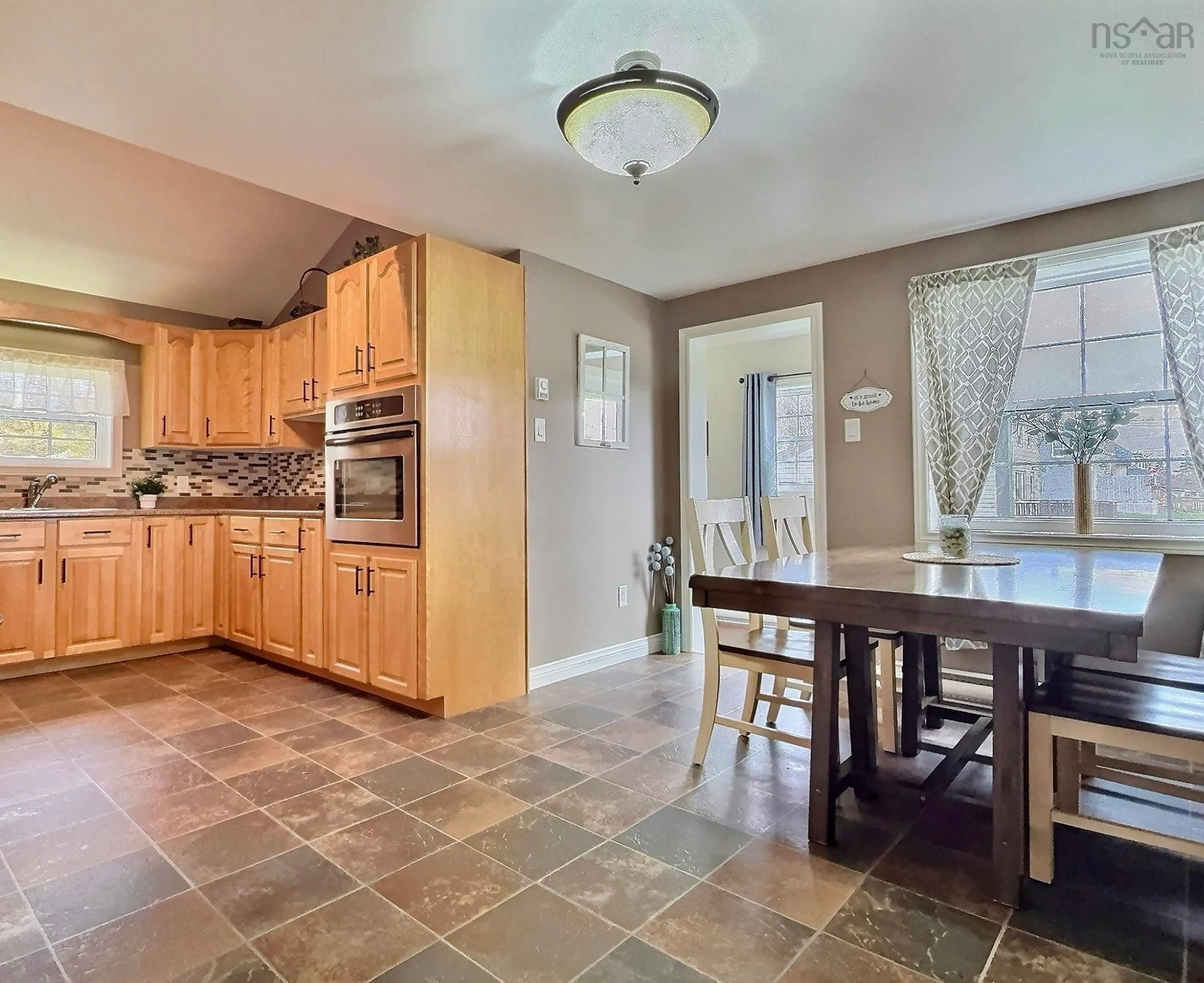 Open concept kitchen, ceramic/tile floor for 12710 Cabot Trail Rd, Grand Étang Nova Scotia B0E 1L0