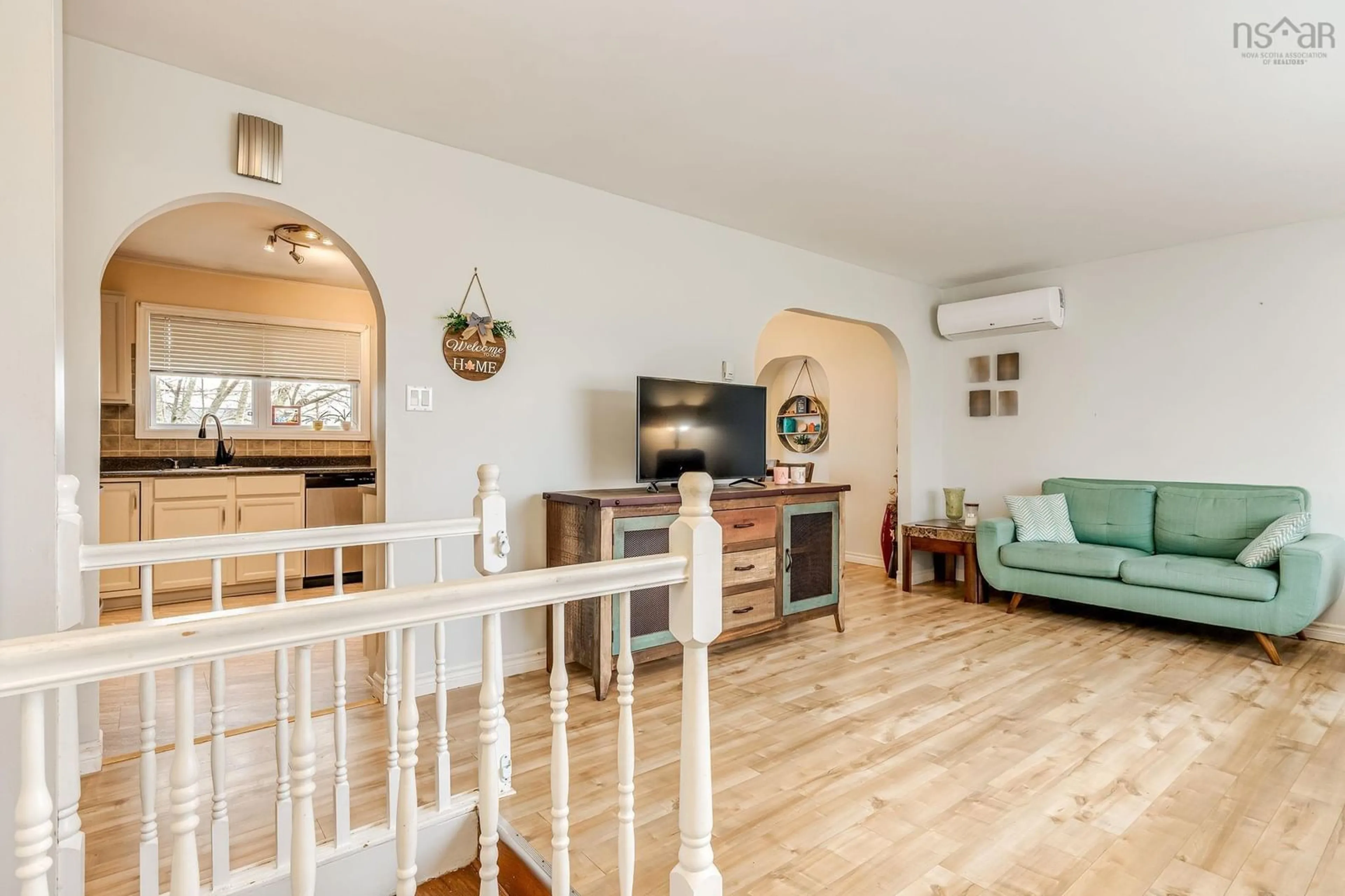 Living room with furniture, wood/laminate floor for 21 Wamphray Cres, Dartmouth Nova Scotia B2W 5B4