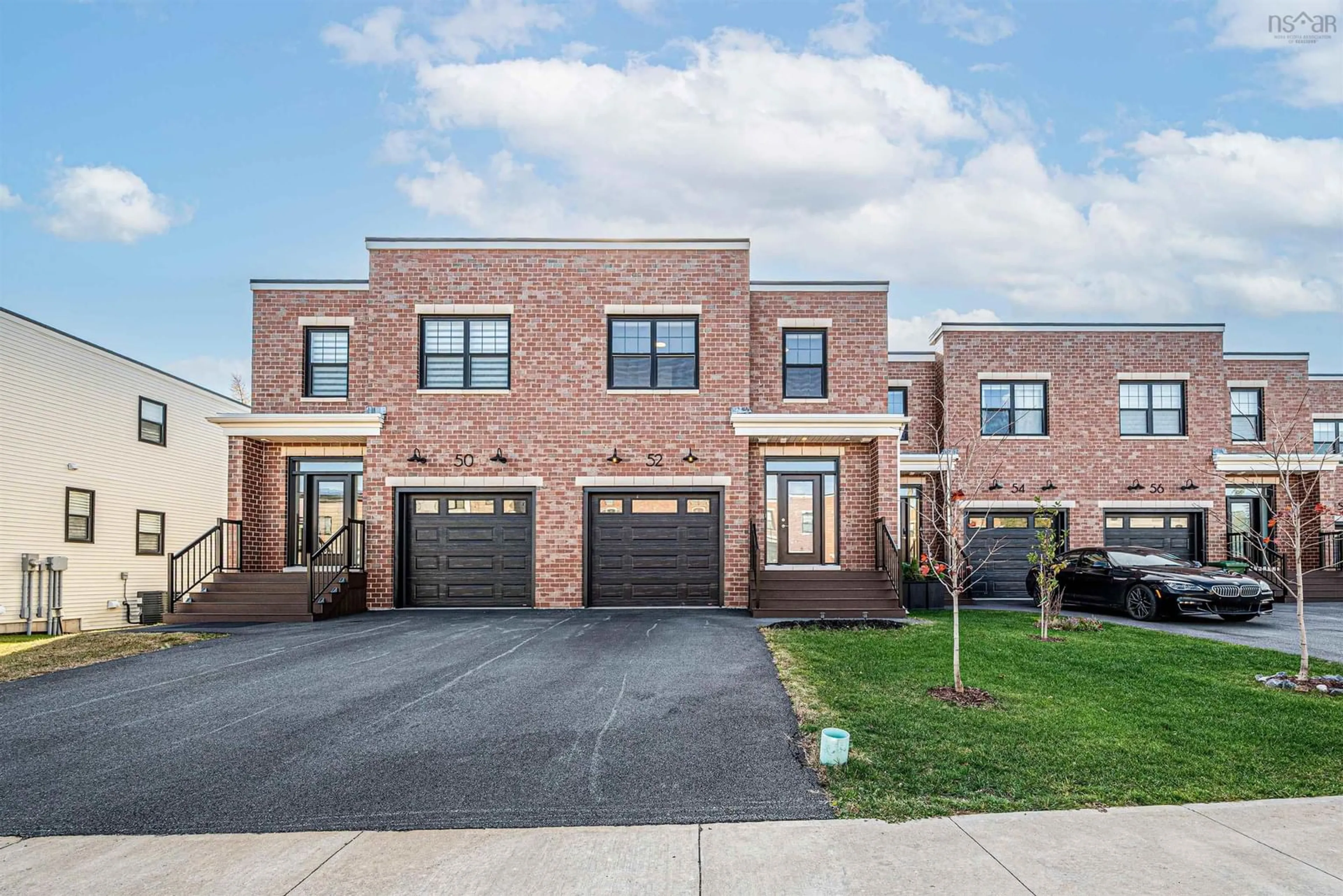 Home with brick exterior material, street for 52 Trekker Dr, Bedford Nova Scotia B4B 2K7