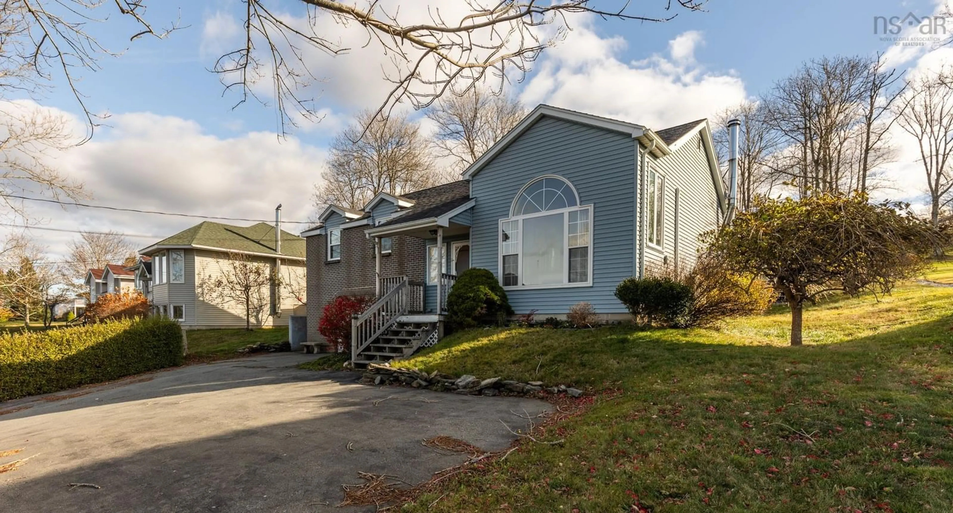 Home with vinyl exterior material, street for 132 Highway 1, Dayton Nova Scotia B5A 5A1