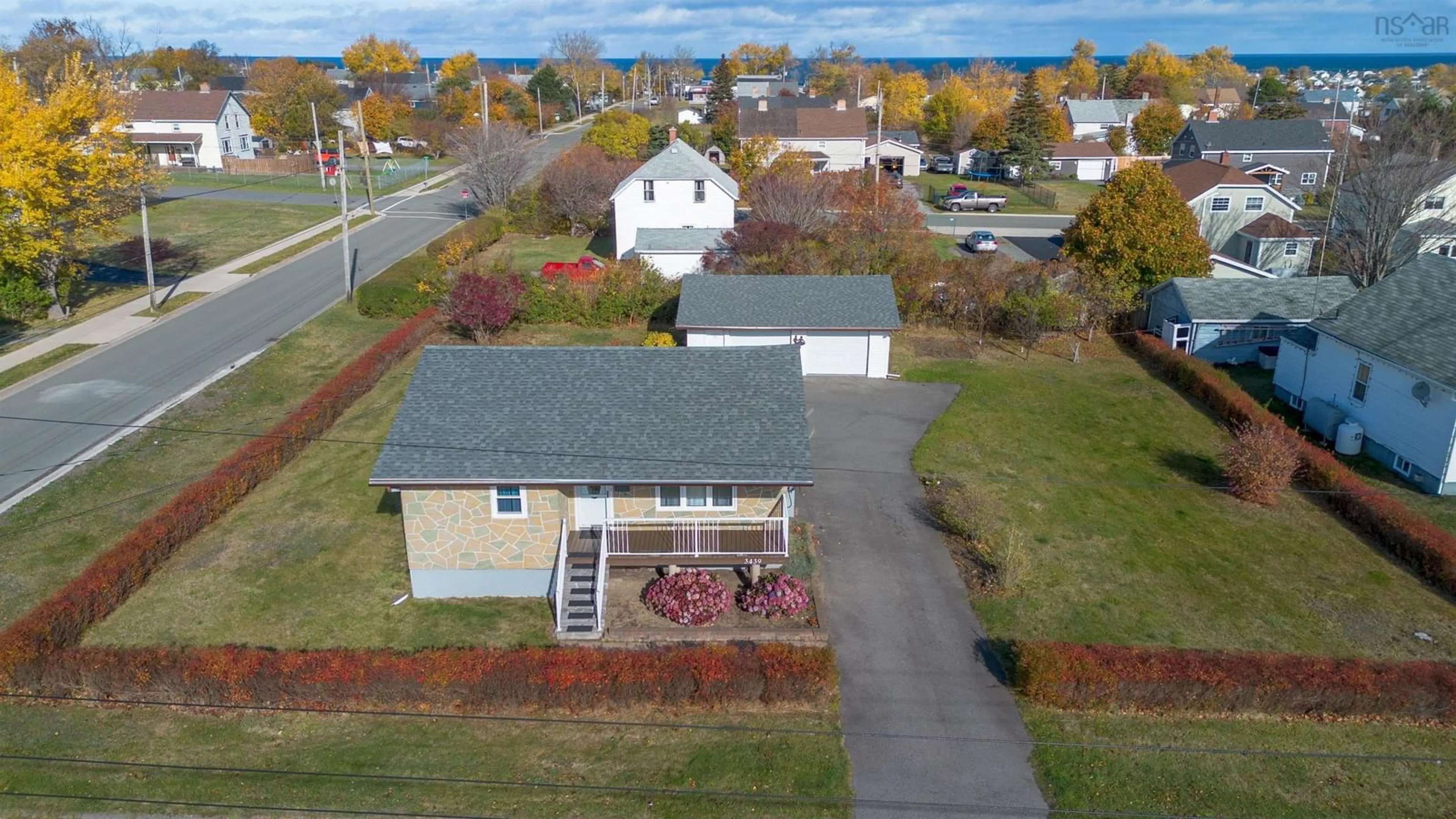 A pic from outside/outdoor area/front of a property/back of a property/a pic from drone, street for 3439 Duggan Ave, New Waterford Nova Scotia B1H 1P4