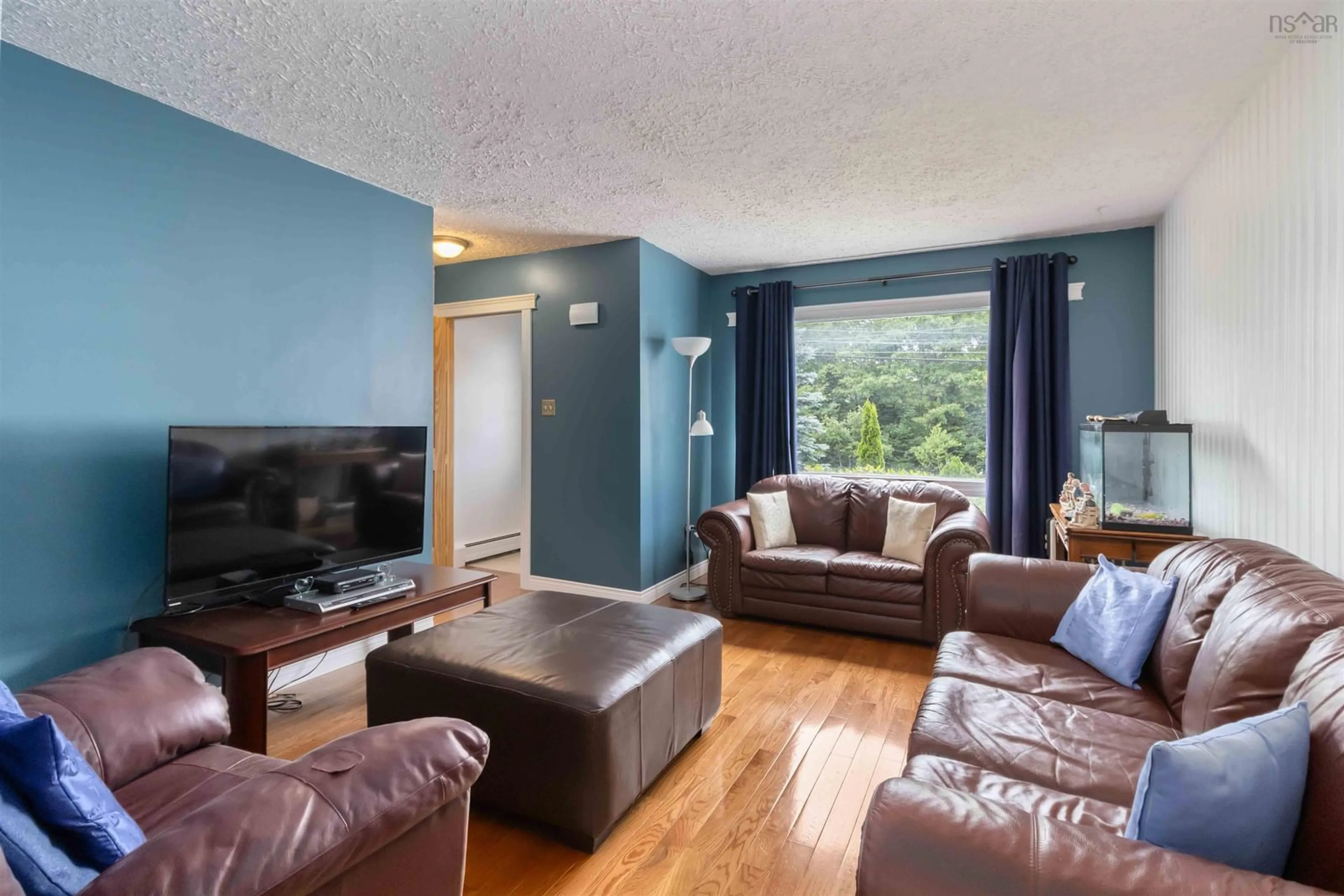 Living room with furniture, wood/laminate floor for 78A Old Sambro Rd, Halifax Nova Scotia B3R 1R2
